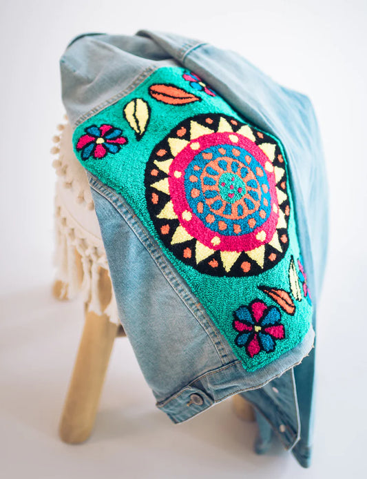 A Wayuu Family's Journey of Needle Punch Patch on a Denim Jacket