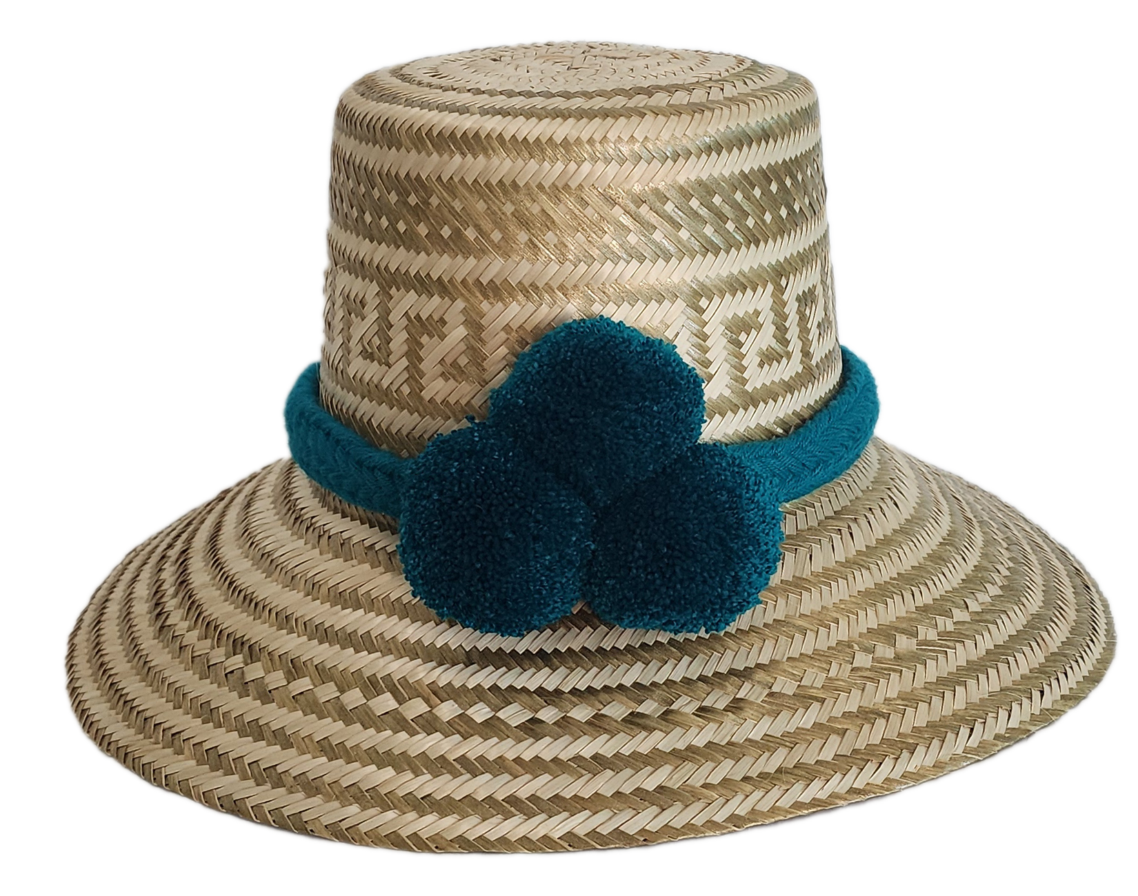 Boho Wayuu straw hat in natural tones with subtle gold accents, adorned with teal pom-poms and a matching braided band — a handcrafted bohemian fashion accessory with colorful artisan charm.
