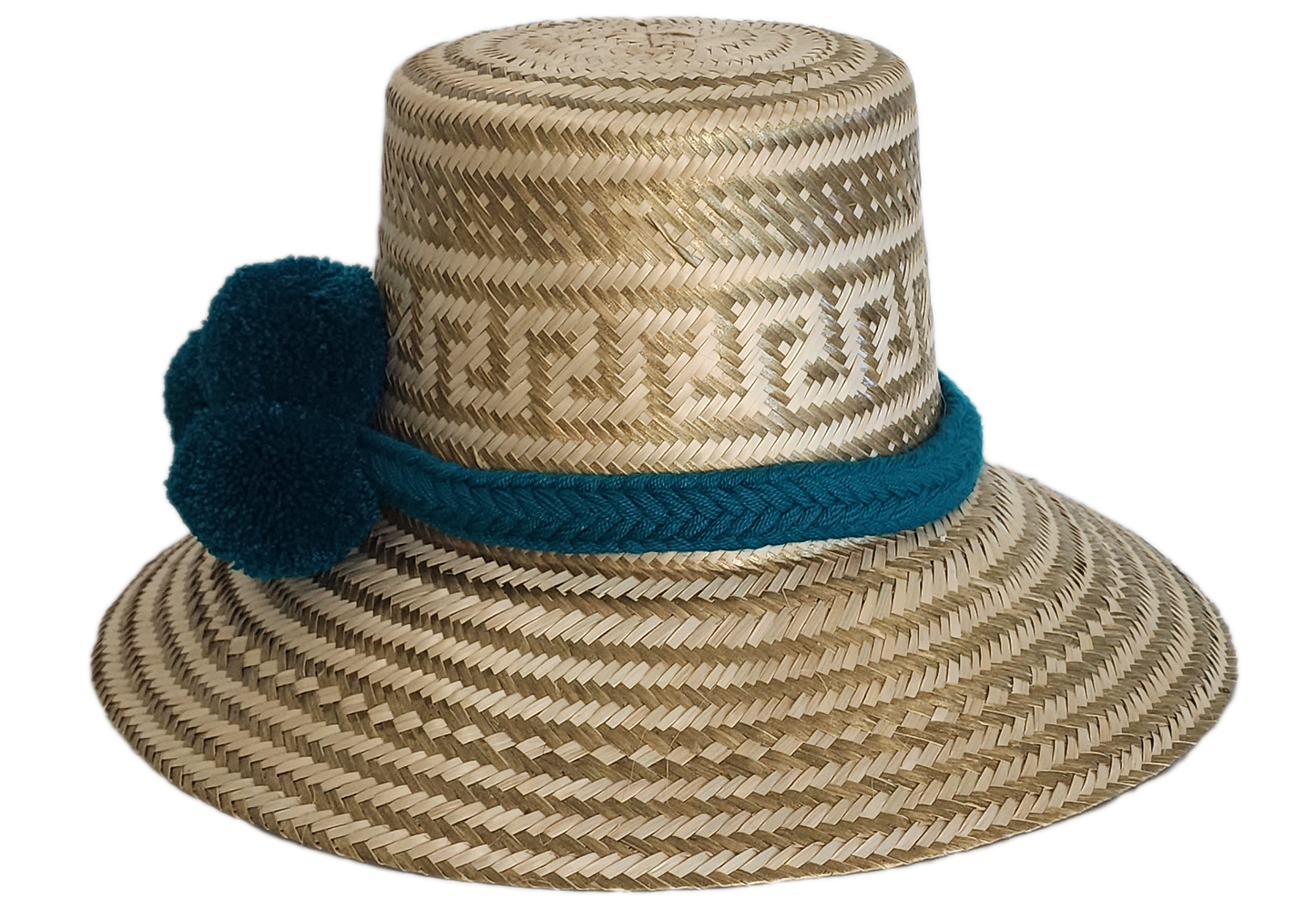 Boho Wayuu straw hat in natural tones with subtle gold accents, adorned with teal pom-poms and a matching braided band — a handcrafted bohemian fashion accessory with colorful artisan charm.