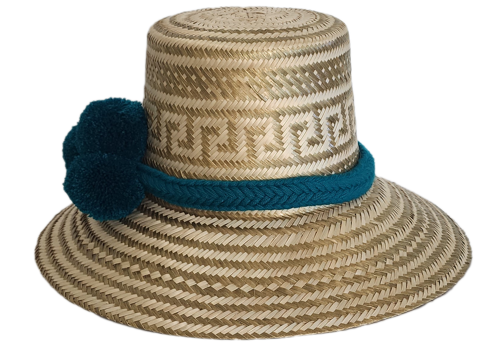 Boho Wayuu straw hat in natural tones with subtle gold accents, adorned with teal pom-poms and a matching braided band — a handcrafted bohemian fashion accessory with colorful artisan charm.
