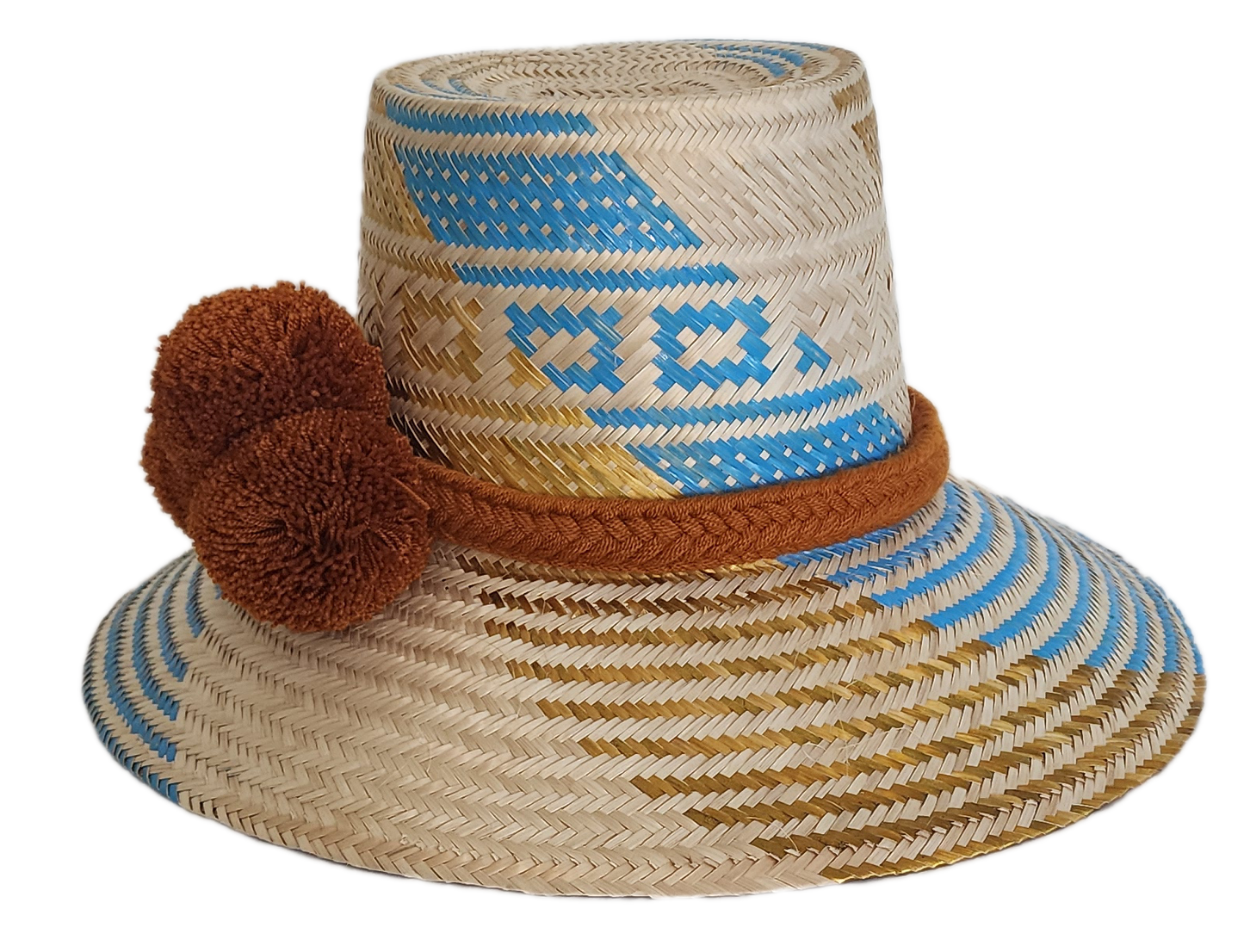 Handwoven Wayuu straw hat featuring blue and gold geometric patterns, a wide brim, and a brown braided band with three pom-pom accents in the front.