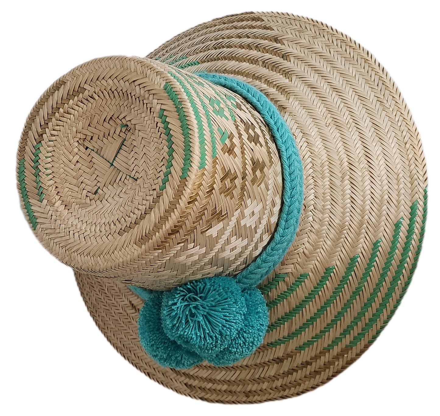 Boho Wayuu straw hat in natural tones with aqua green tribal weave, matching braided band, and teal pom-poms — a minimalist, colorful, and handcrafted bohemian accessory perfect for summer.