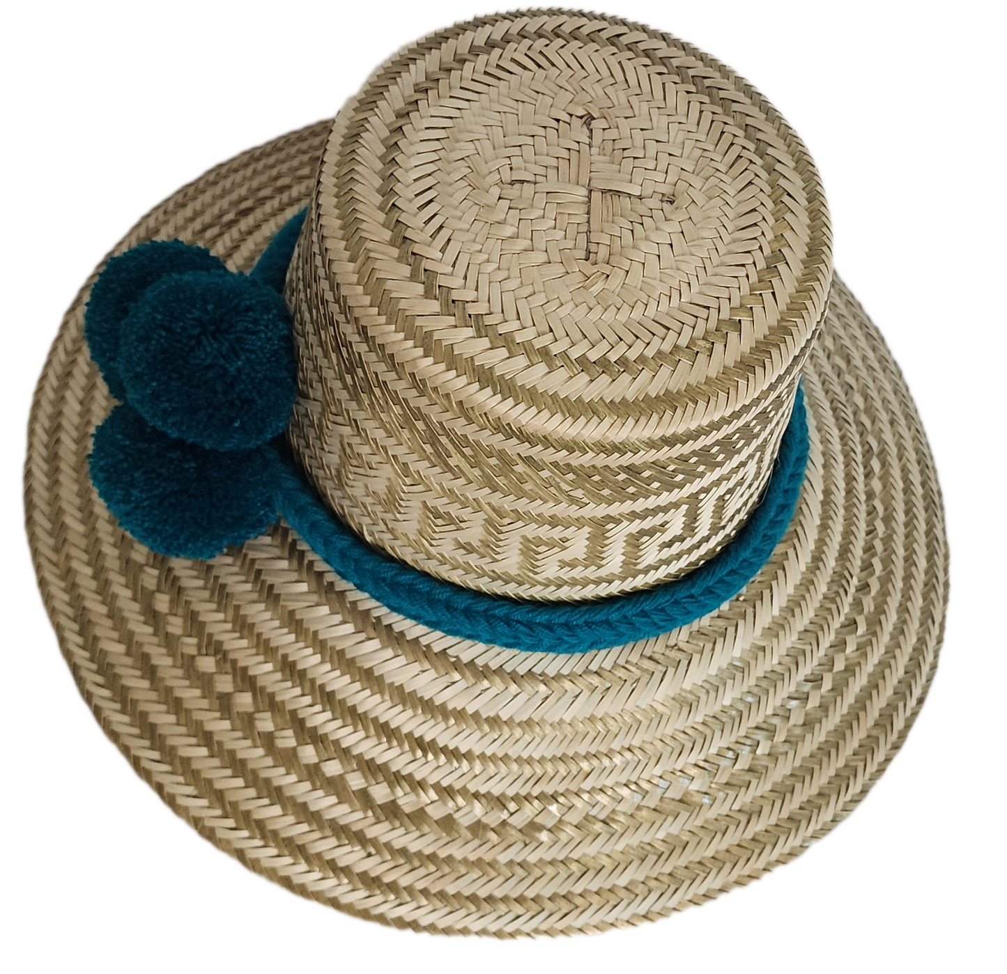 Boho Wayuu straw hat in natural tones with subtle gold accents, adorned with teal pom-poms and a matching braided band — a handcrafted bohemian fashion accessory with colorful artisan charm.