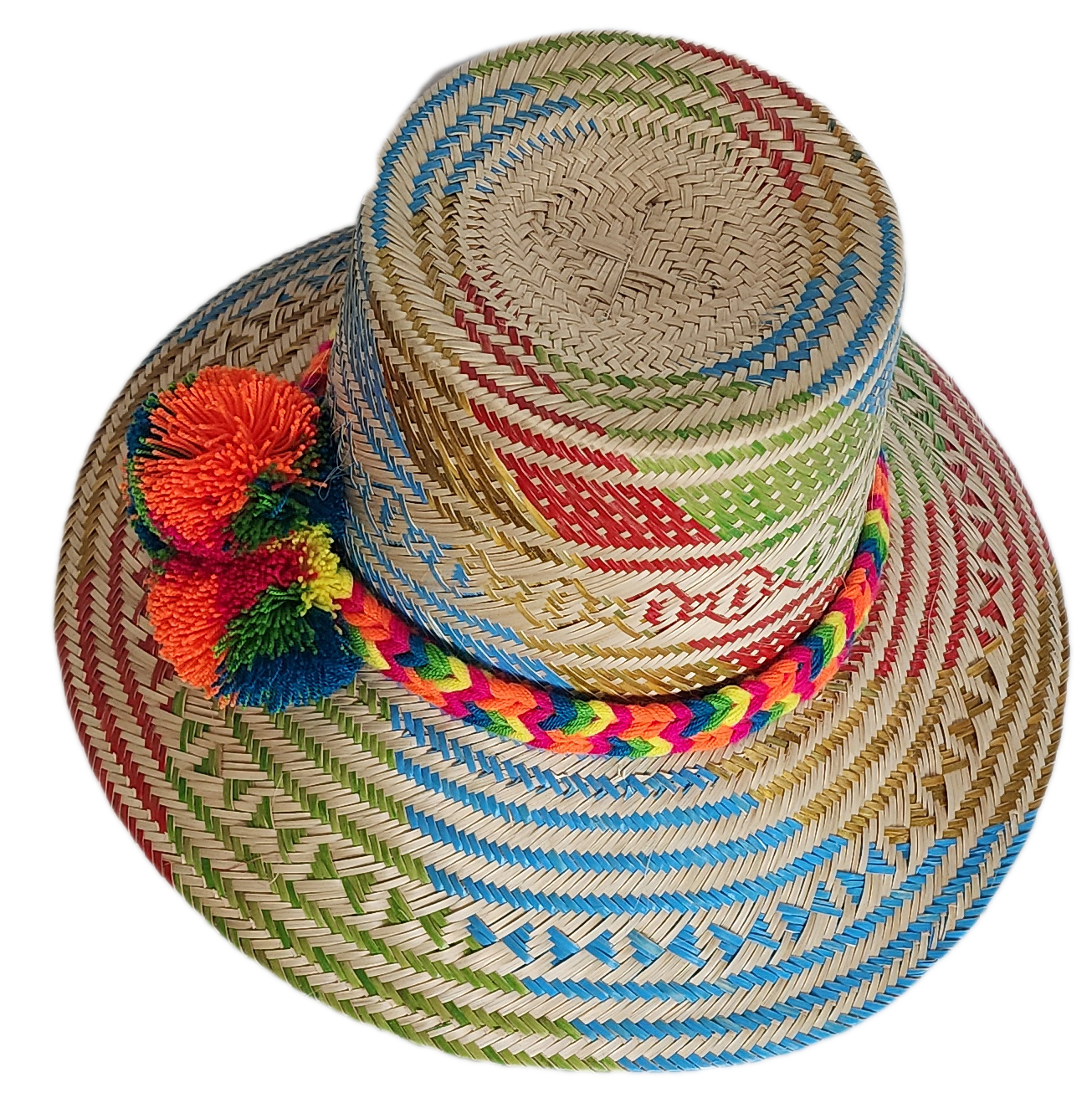 Boho Wayuu straw hat featuring colorful artisan weave in blue, red, green, and gold, with a rainbow braided band and bright orange pom-poms — a handcrafted bohemian accessory full of vibrant summer flair.