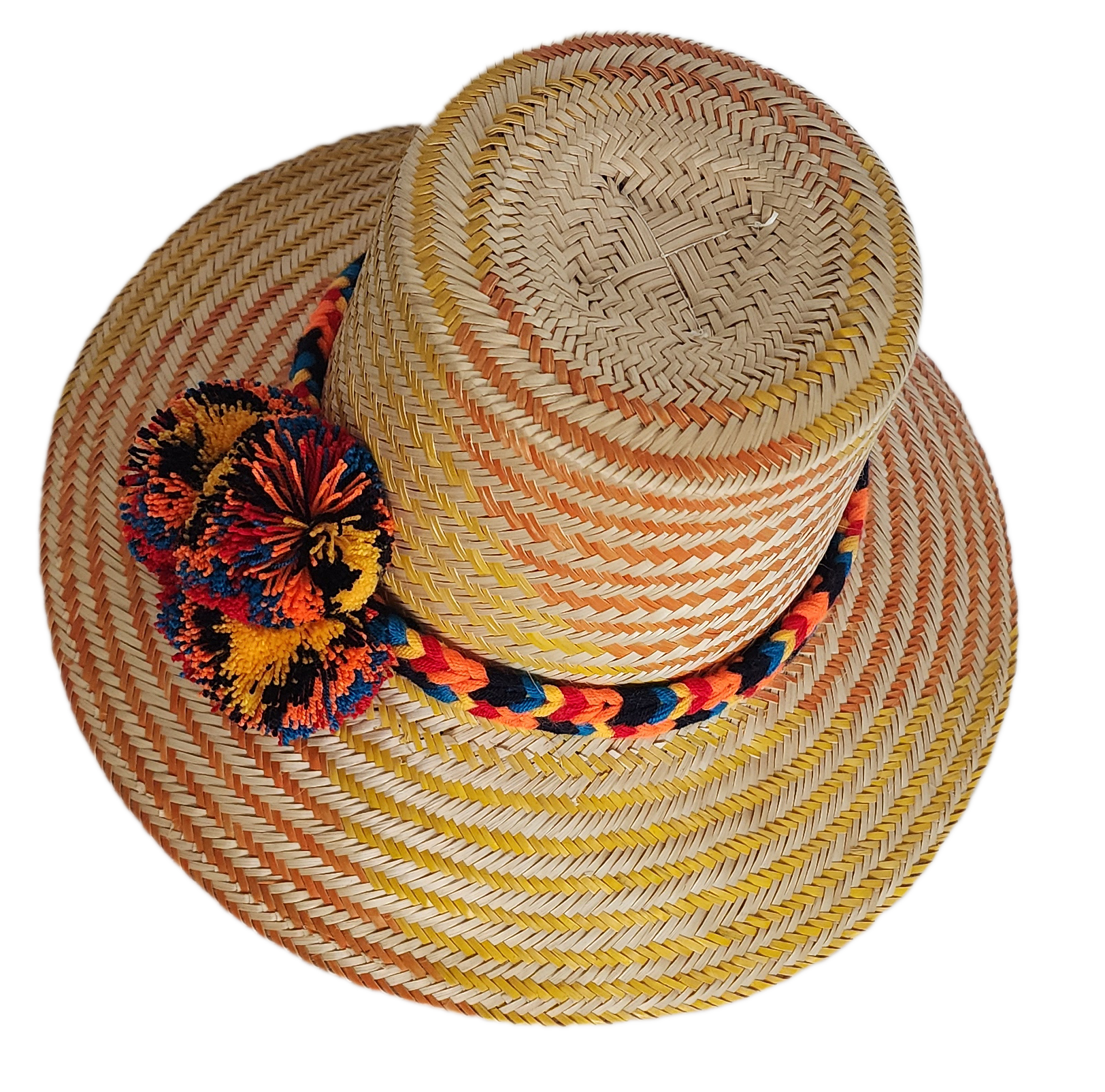 Boho Wayuu straw hat with warm orange and yellow woven patterns, a colorful braided band, and bold multicolor pom-poms — a vibrant, handcrafted bohemian accessory full of artisan detail.