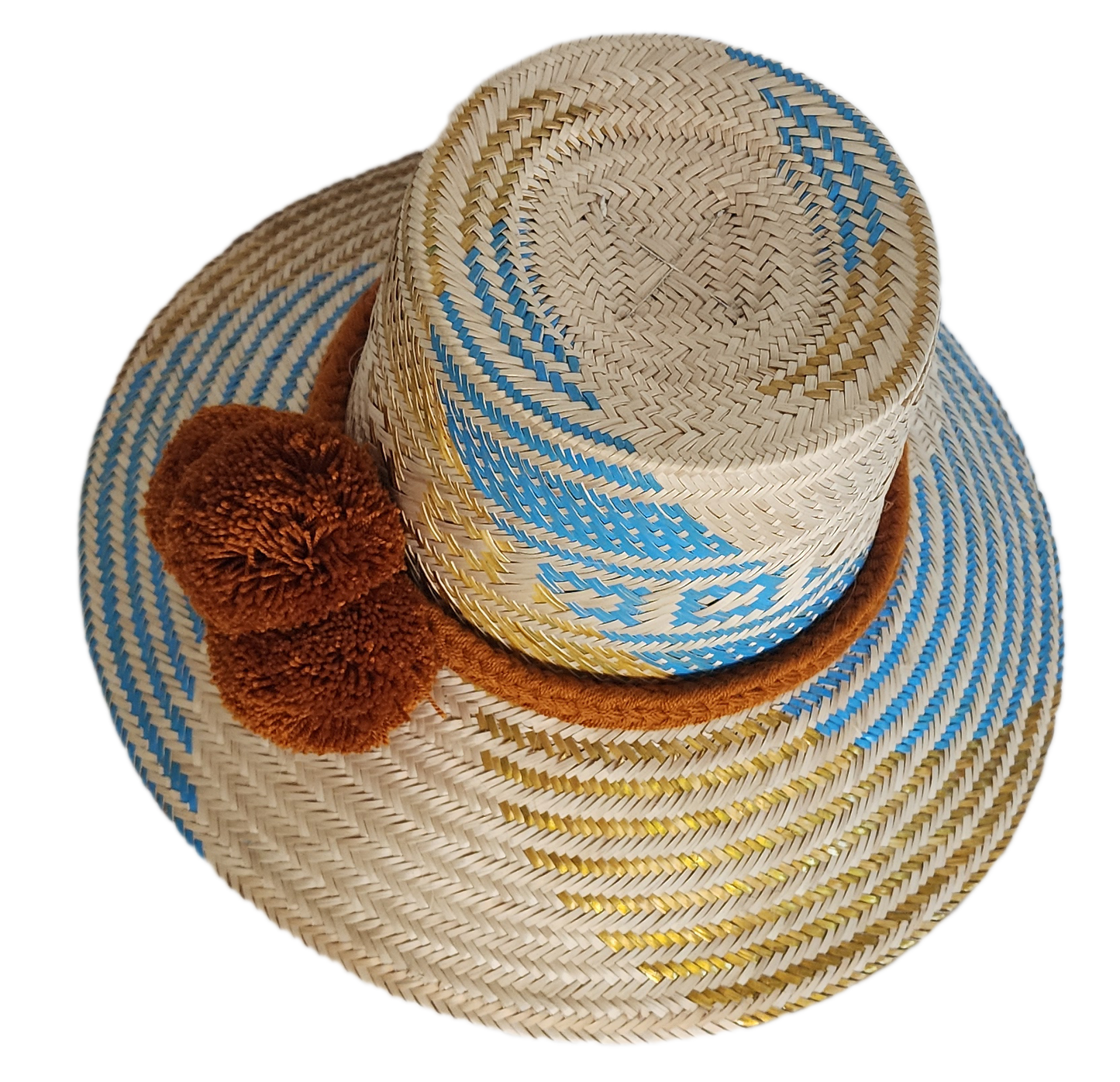 Handwoven Wayuu straw hat featuring blue and gold geometric patterns, a wide brim, and a brown braided band with three pom-pom accents in the front.