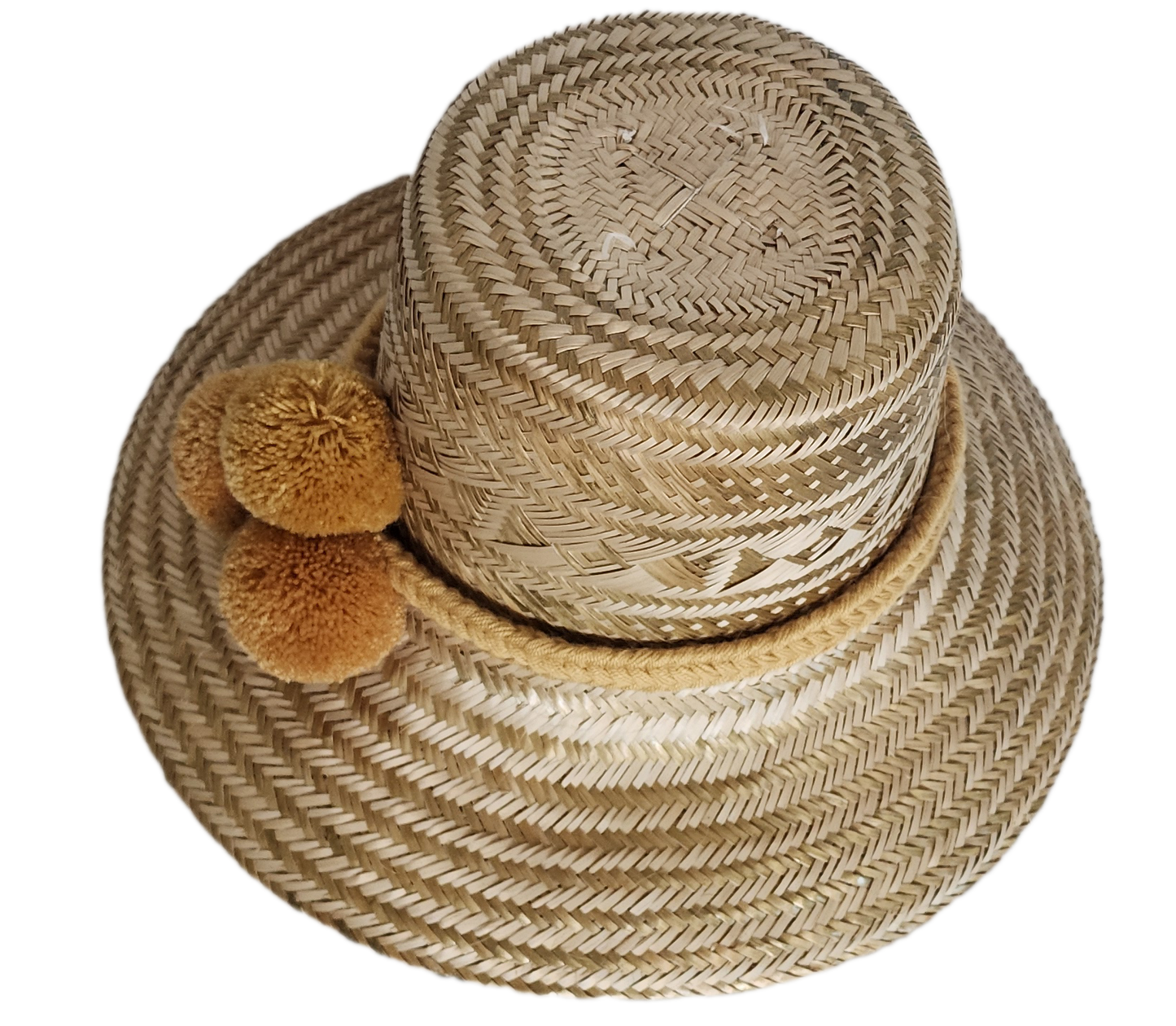 Boho Wayuu straw hat in natural beige tones with intricate geometric patterns, a soft mustard pom-pom trio, and braided band — a handcrafted, bohemian-style accessory with artisan elegance.