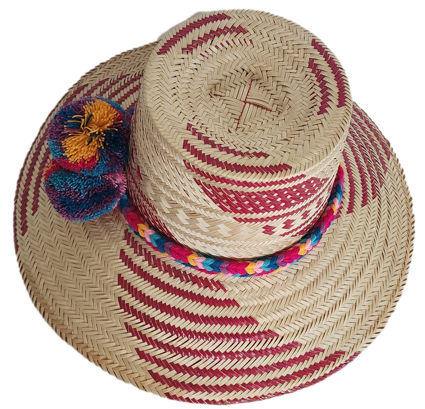 Handmade straw hat with red woven designs and a cheerful, fluffy pompom band in shades of blue, red, yellow, and purple, adding a colorful touch.