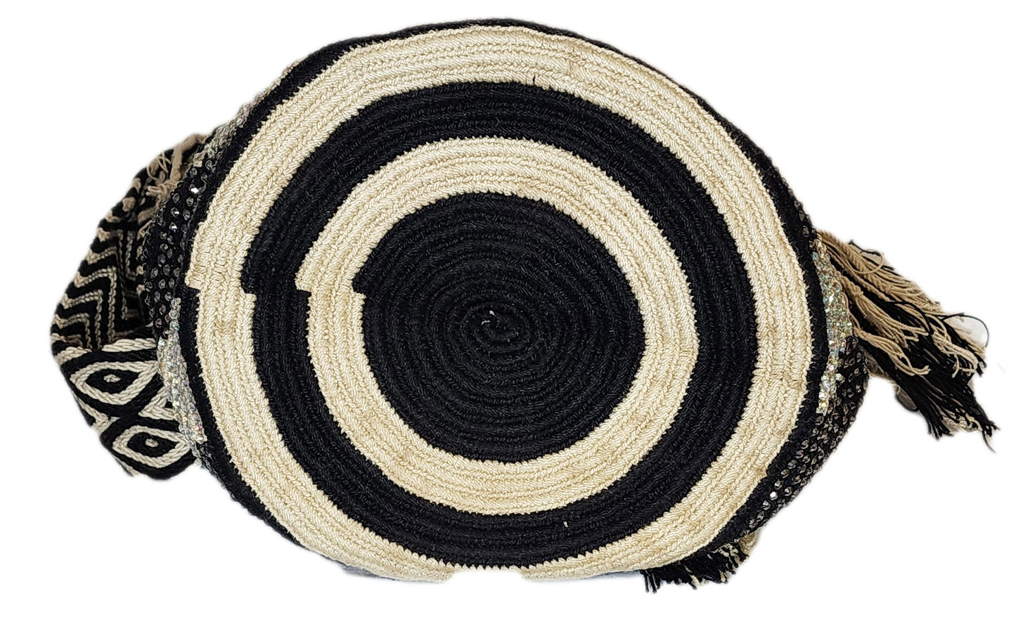 Black and white Wayuu crochet bag with artisan details and woven strap.