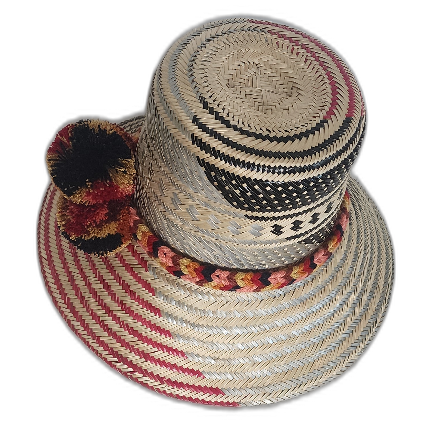 Colorful Wayuu hat with red spiral brim, black and gold pompoms, and braided band