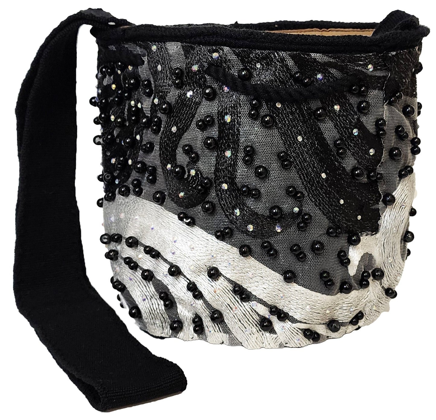 Beaded Wayuu bag with wavy embroidery, black strap, and handmade details.