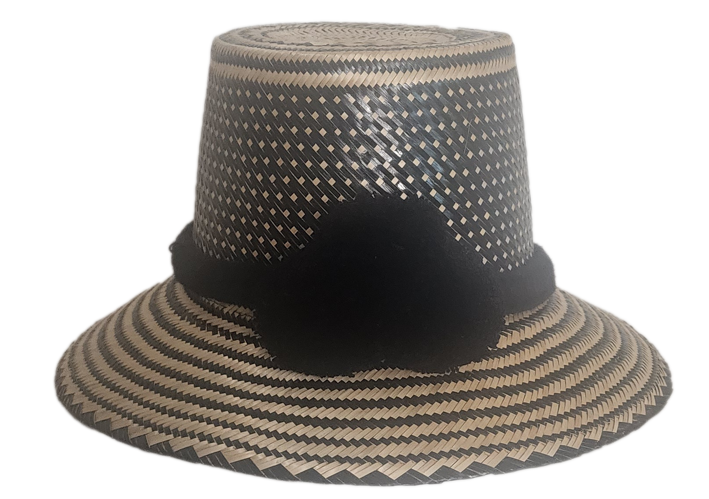Handmade boho straw hat with black pom-poms and minimalist geometric weave