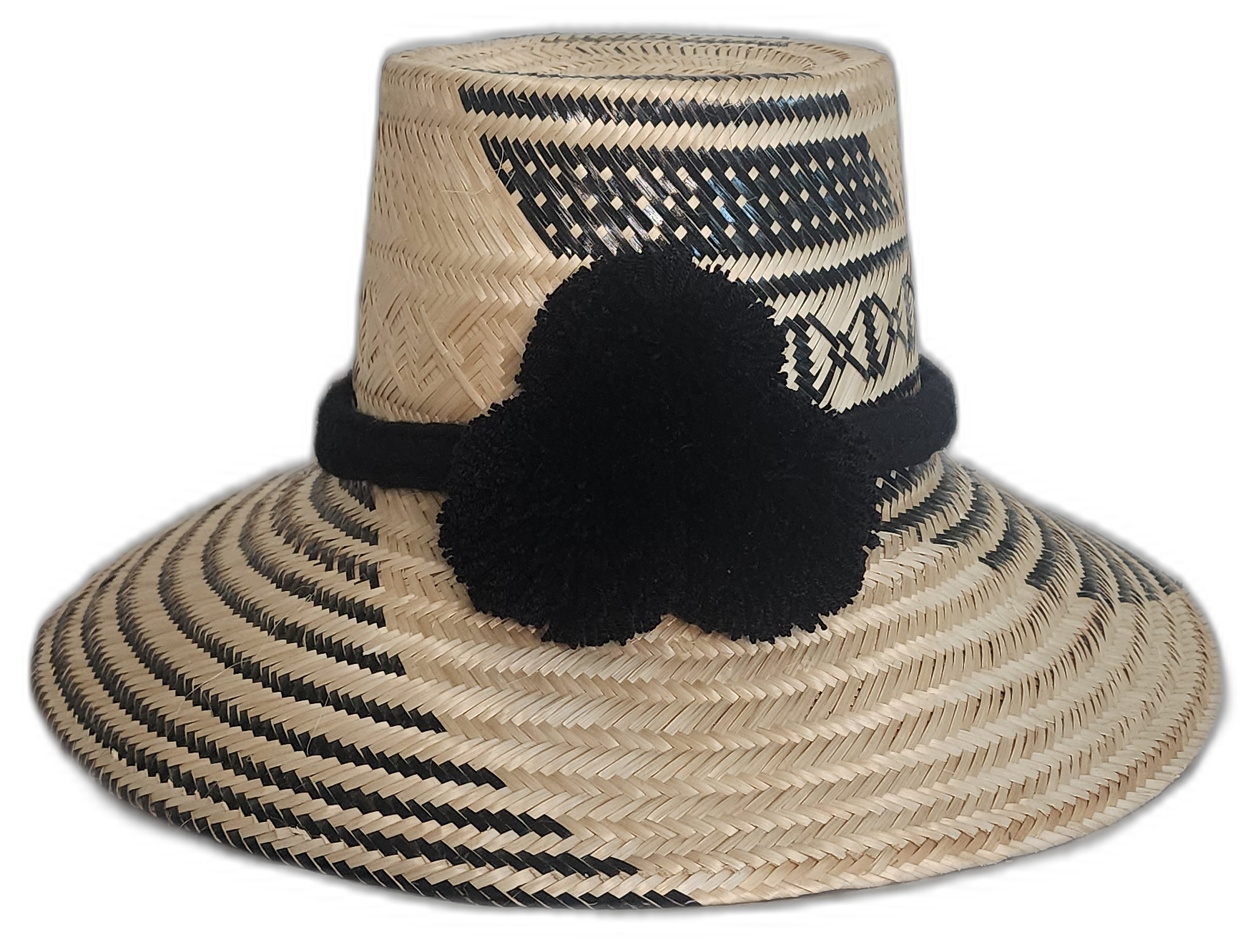Black and natural Wayuu handmade straw hat with solid black pompoms and intricate geometric patterns.