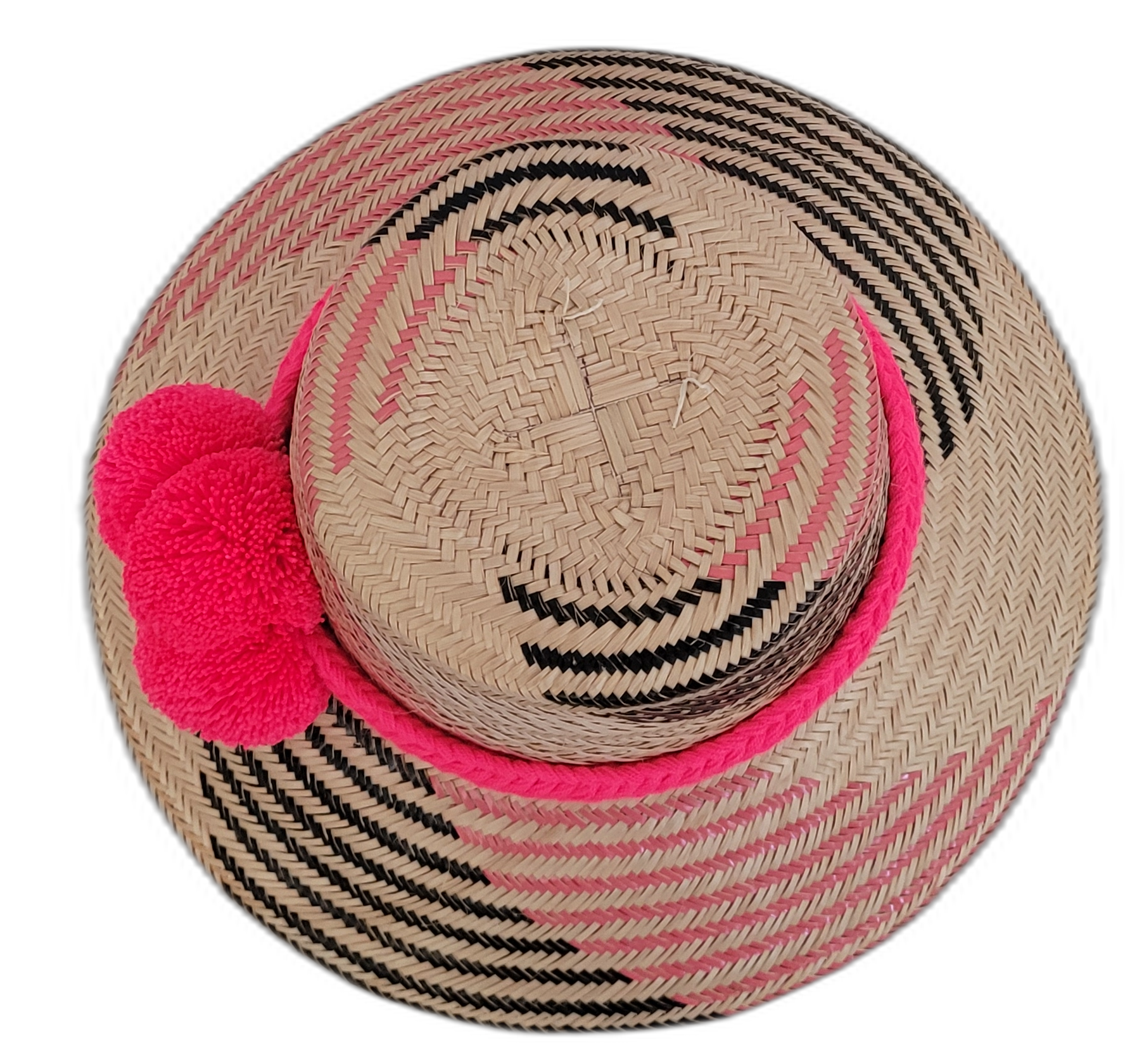 Bohemian straw hat in pink and black, handmade with Iraca palm, decorated with signature Wayuu pompoms, elegant and stylish.