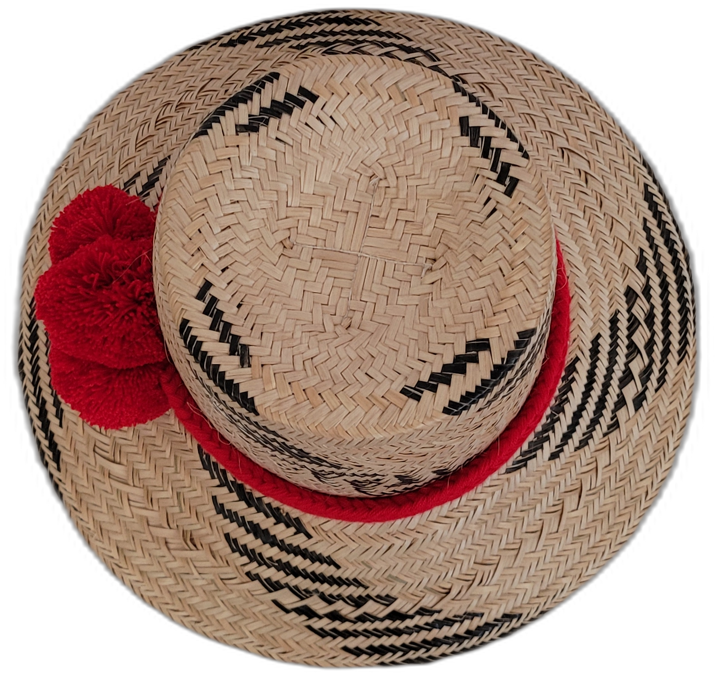 Black and natural Wayuu handmade straw hat with eye-catching red pompoms.