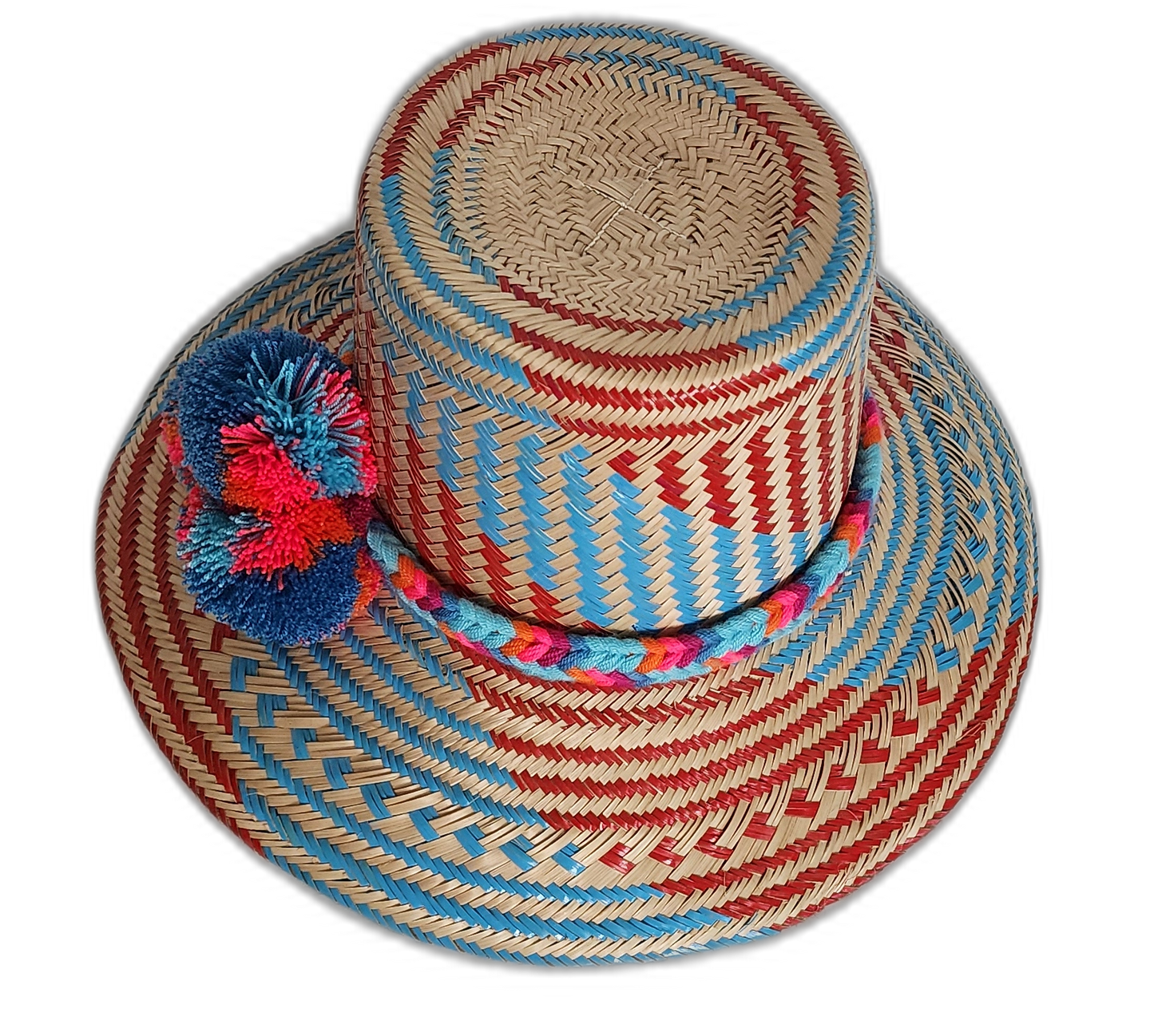 Boho Chick hat featuring woven red-blue pattern and bold pompoms