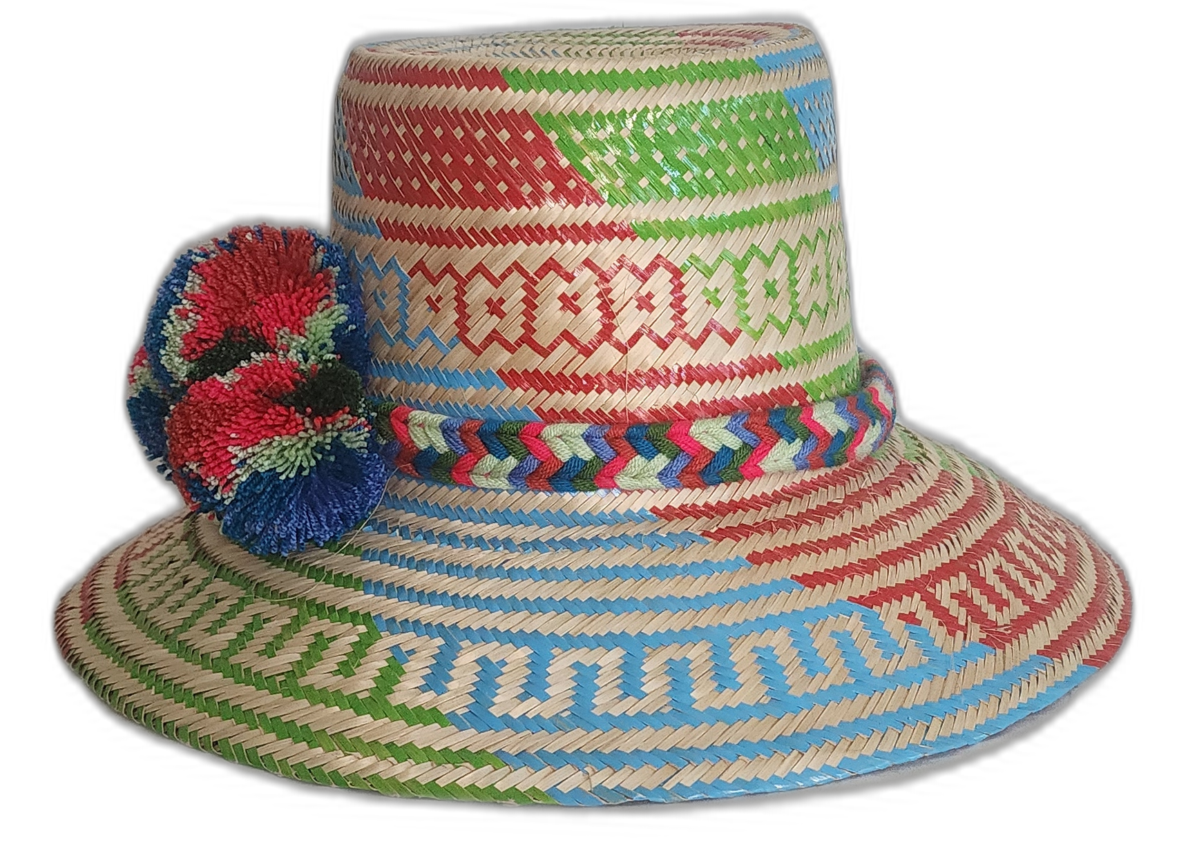 Bohemian chick hat crafted with bright artisan weaving and large cultural pompoms in red and navy tones.