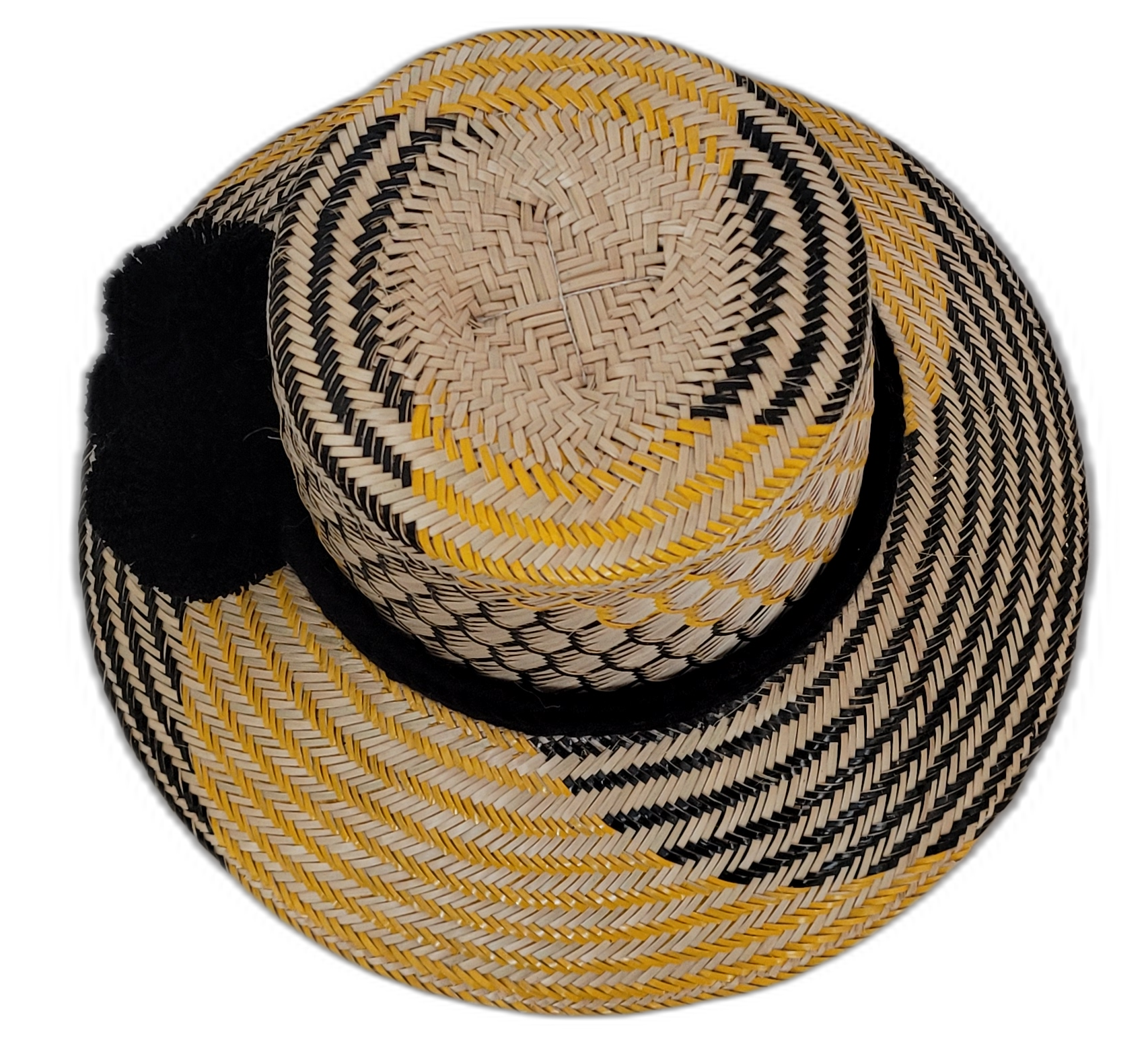 Black and yellow Wayuu hat with cultural pompoms and bold contrast