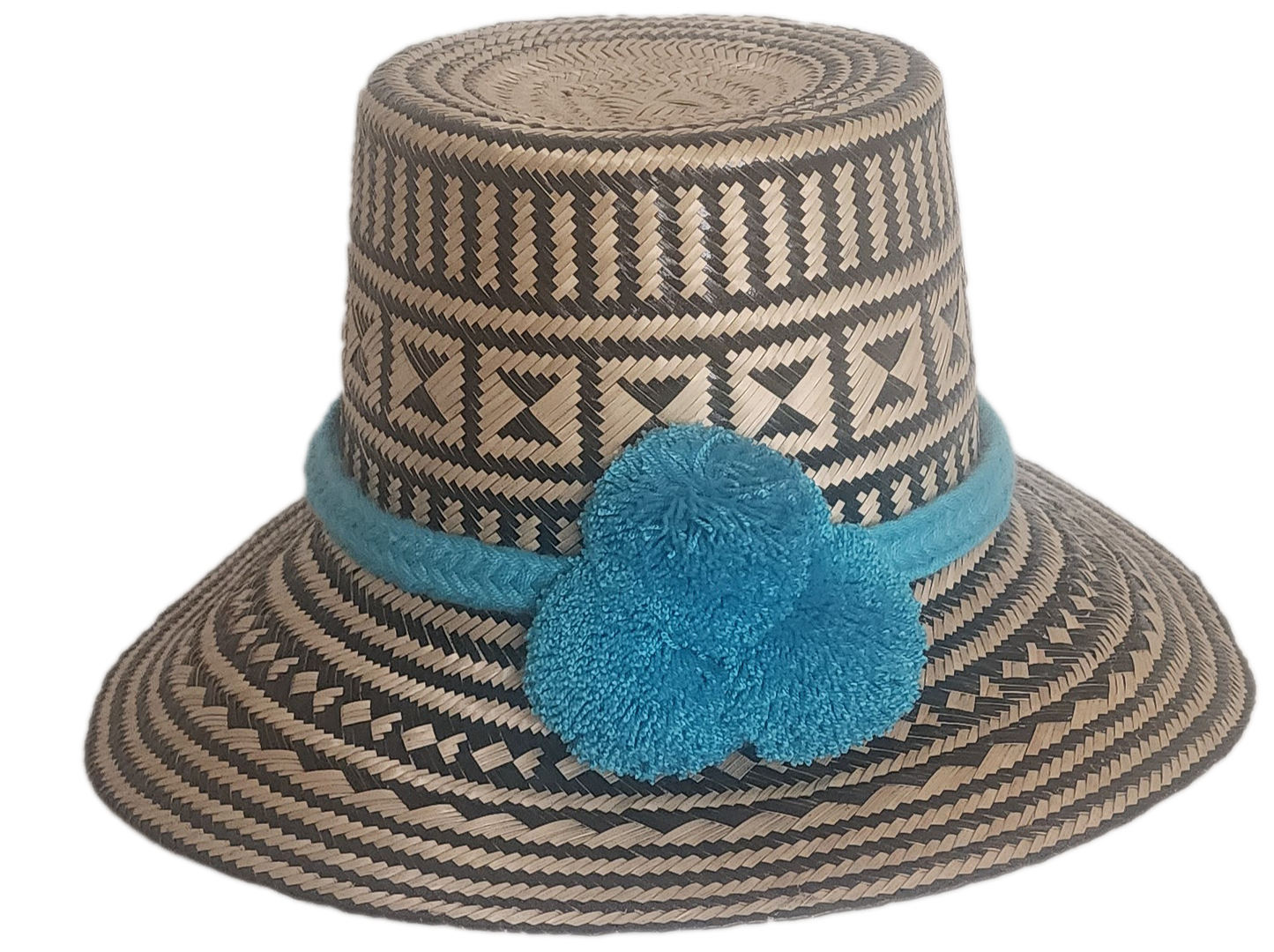 Handmade boho straw hat with turquoise pompoms and bold geometric weave