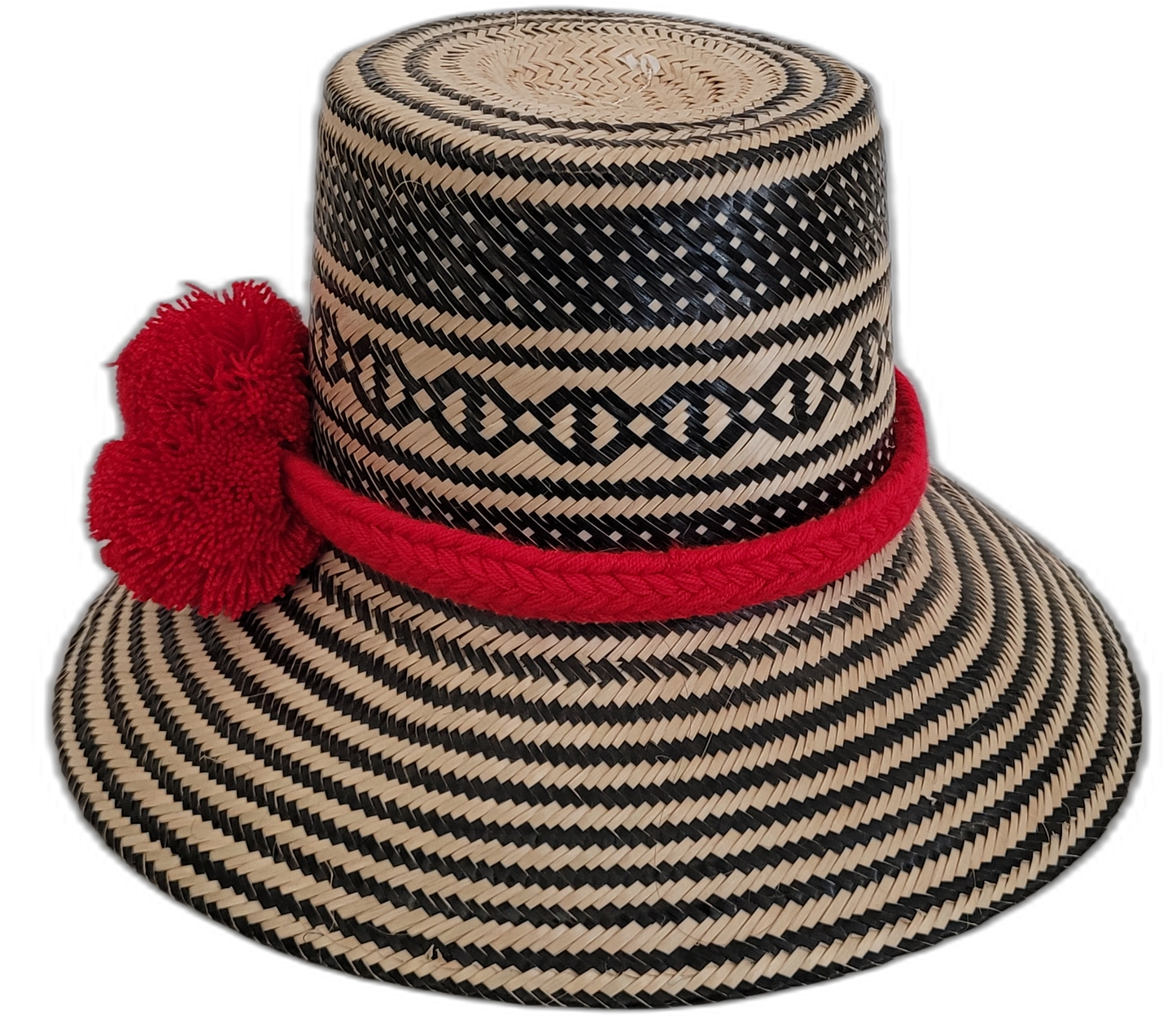 Colorful Boho straw hat, crafted from Iraca palm, featuring red pompoms and striking black-beige weave.