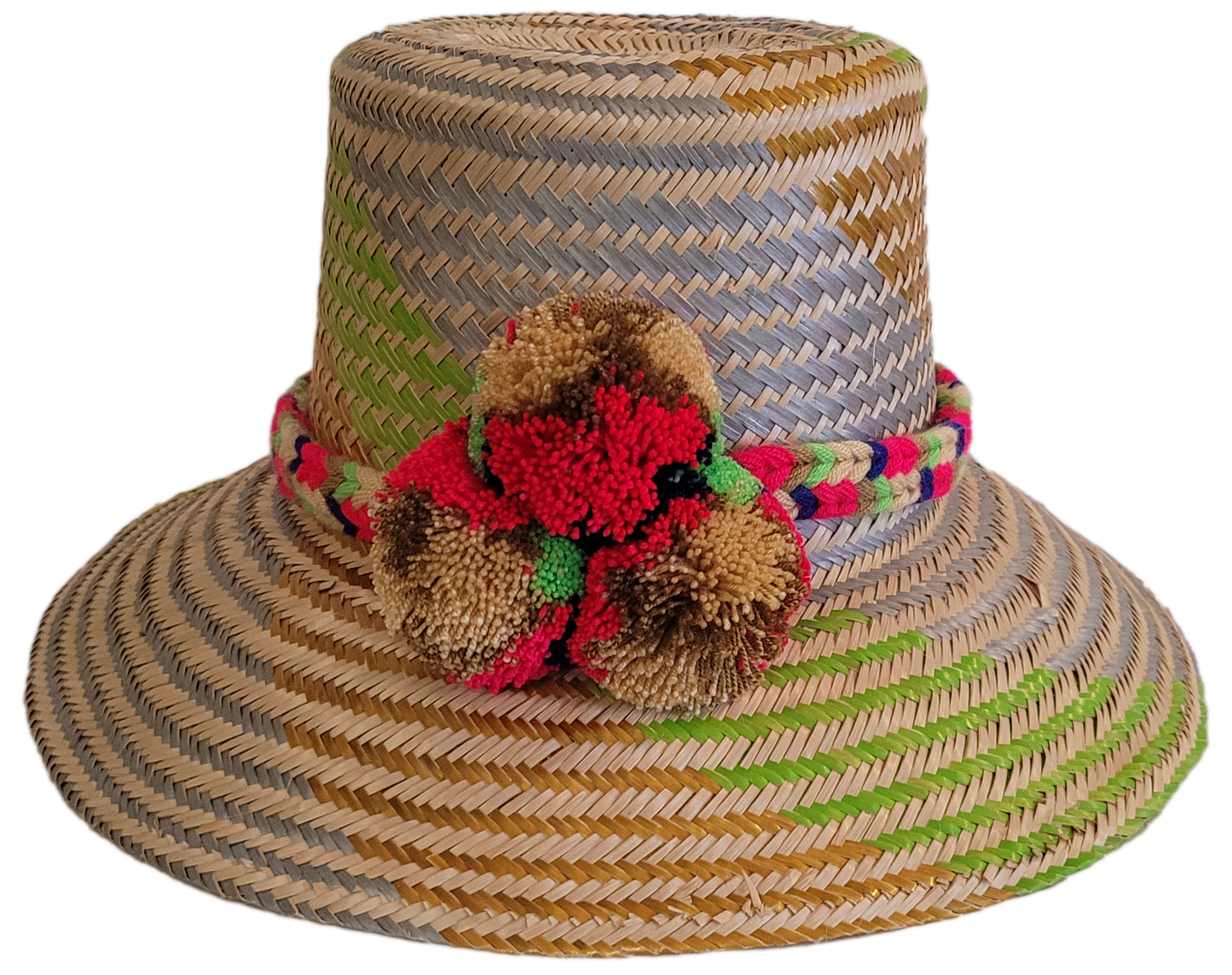 Handmade Wayuu straw hat with lavender, lime, and red pompom accents.