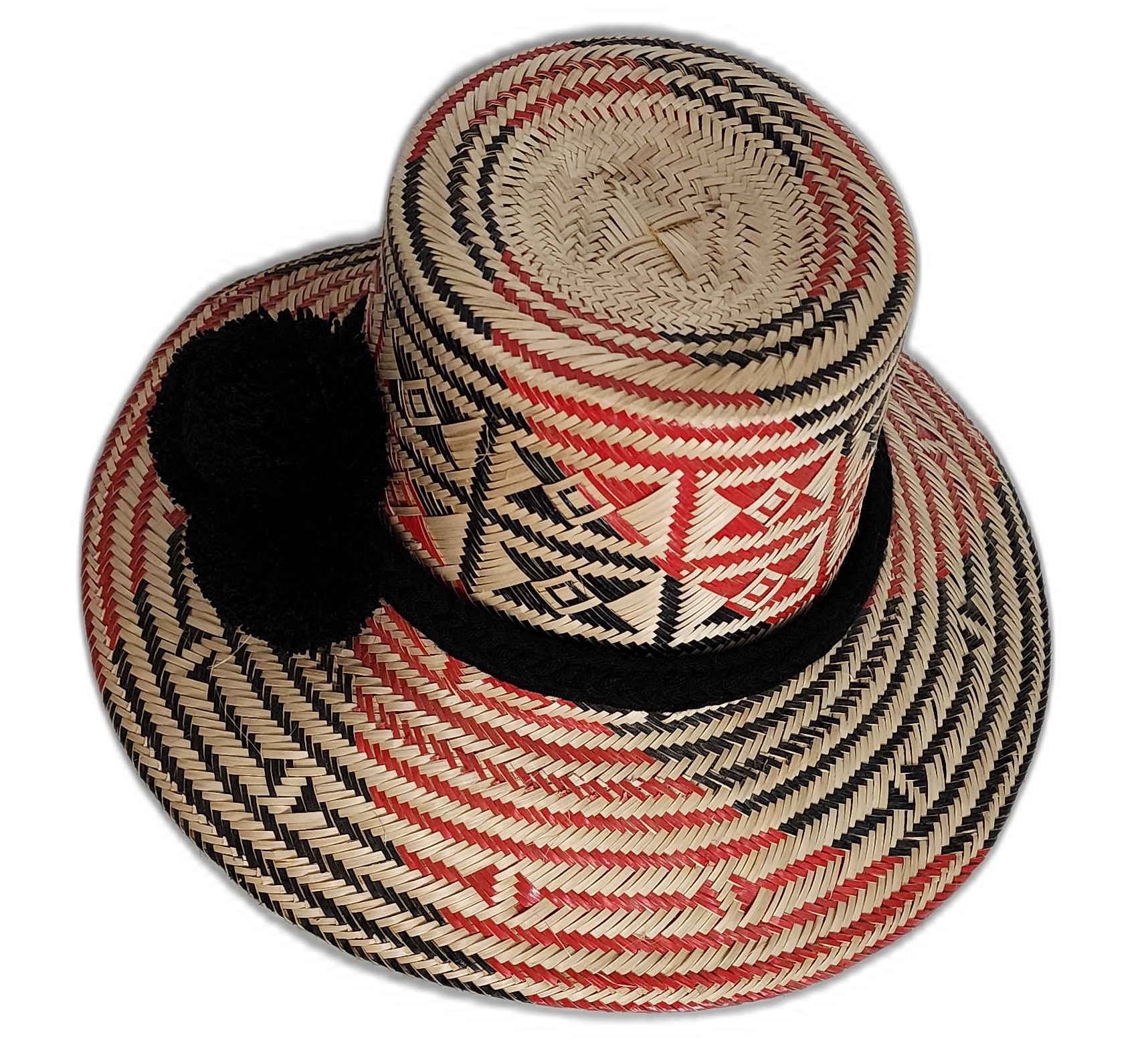 Artisan Wayuu hat in natural palm straw with black pompom detailing