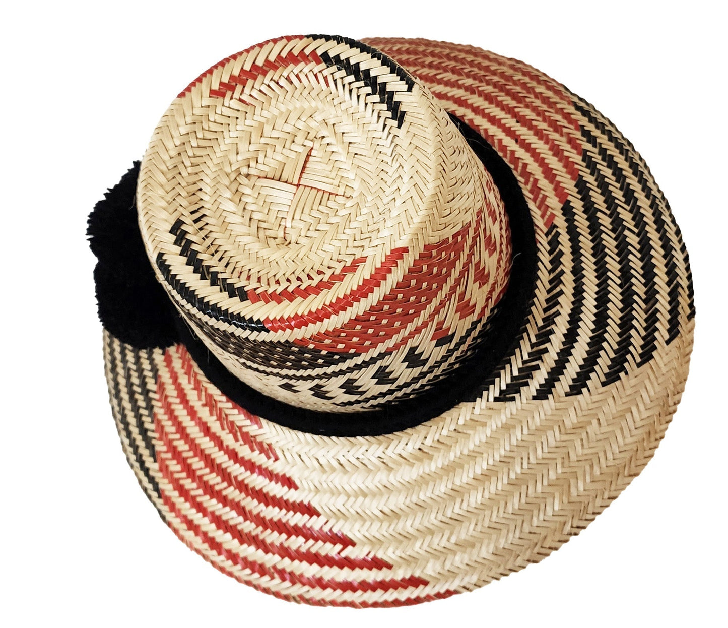 "Colorful Artisan Wayuu Hat handcrafted from iraca palm fibers, featuring vibrant designs and broad brim for sun protection."