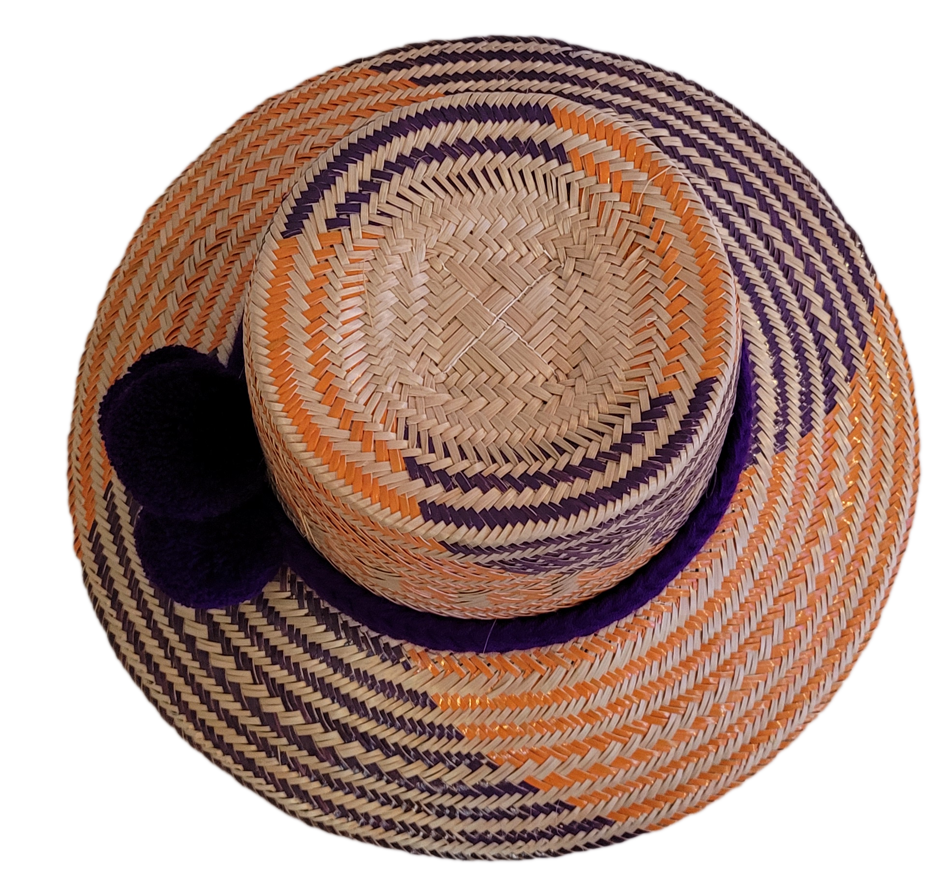 Unique Boho chick straw hat, handmade from Iraca palm in vibrant purple and orange.
