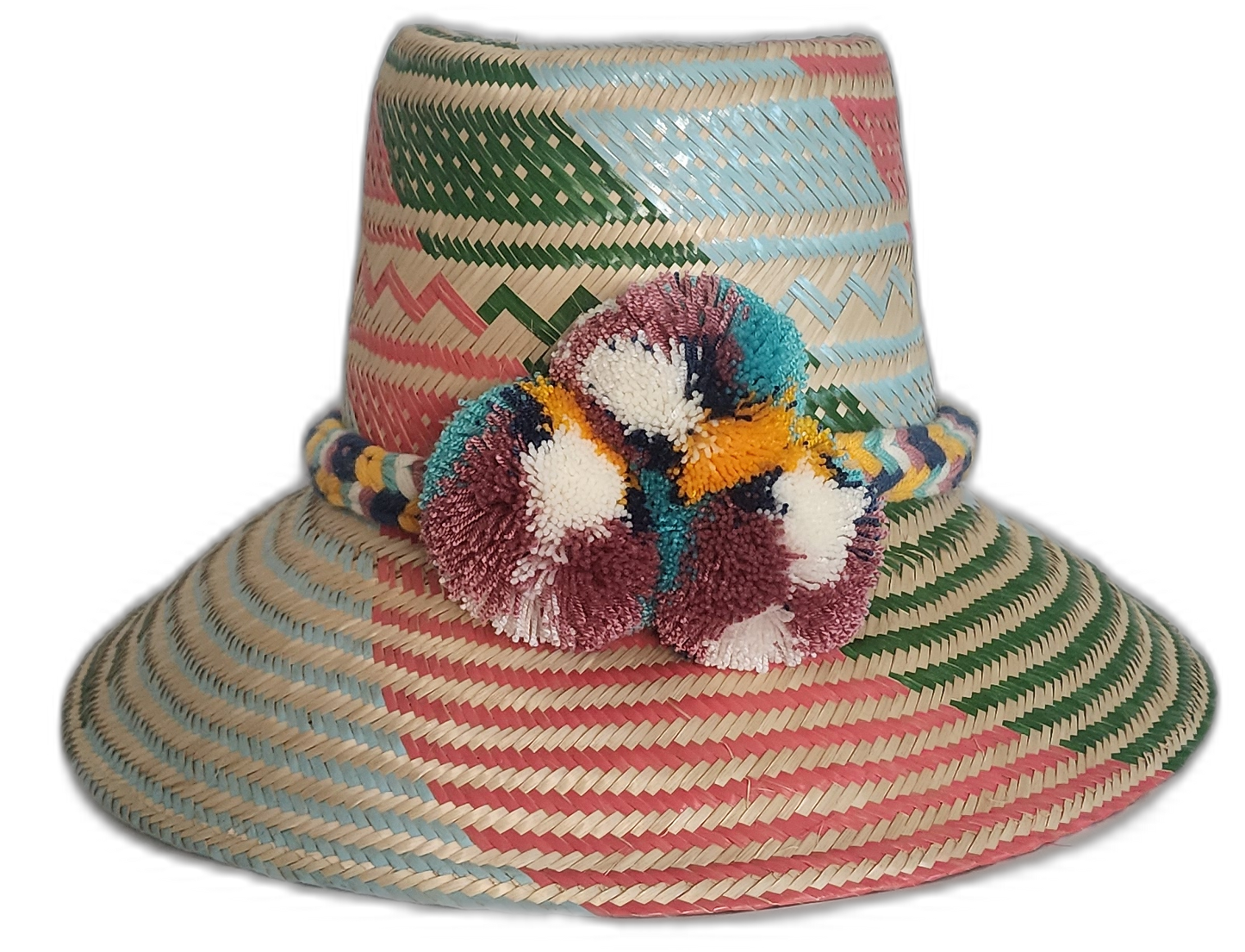 Handmade boho straw hat with vibrant pastel stripes and multicolor pompoms, crafted by Wayuu artisans.