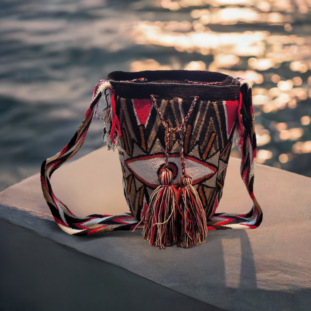 "Colorful handcrafted Wayuu crochet bag with unique geometric patterns, crafted by indigenous artisans, suitable for versatil