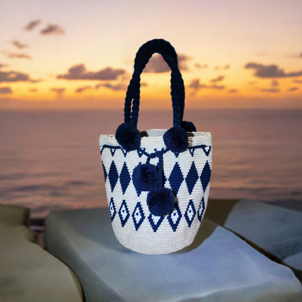 "Colorful handcrafted Wuitusu Wayuu crochet bag with a short handle, showcasing vibrant, unique patterns and fair trade craft