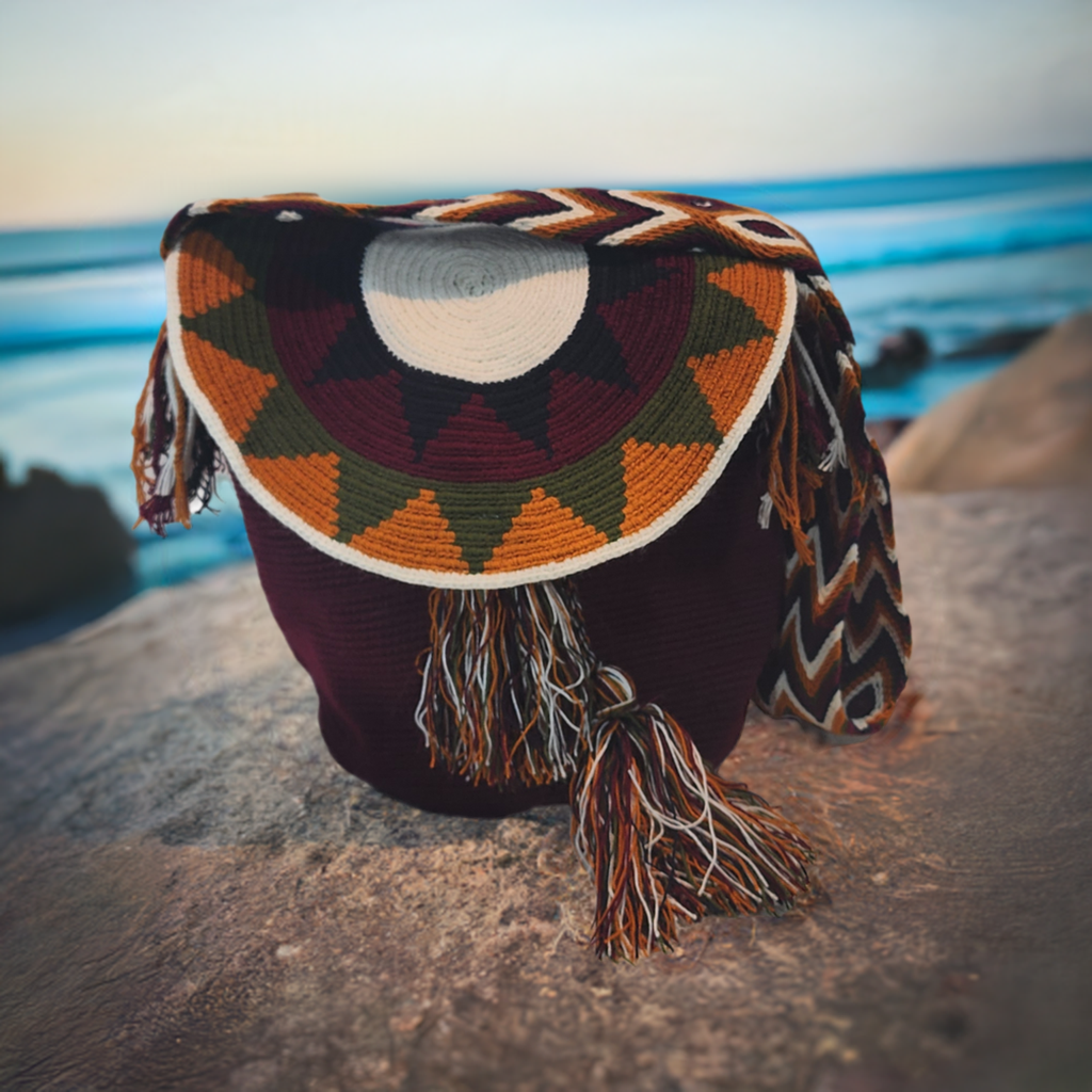 "Colorful handcrafted Wuitusu Wayuu crochet bag with lid, featuring intricate patterns and a blend of vibrant colors."