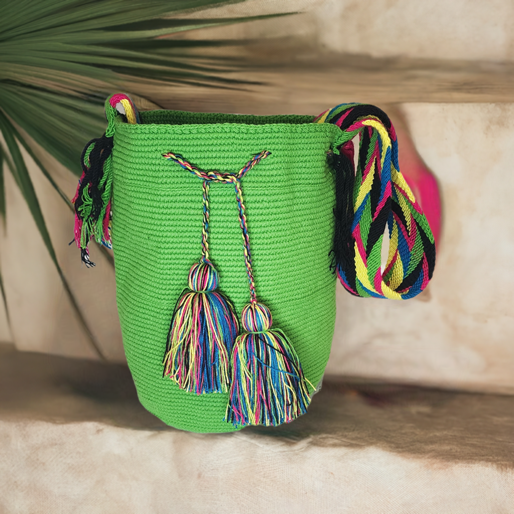 "Colorful handmade crochet bags by Wayuu women of Colombia, featuring vibrant, culturally symbolic designs."