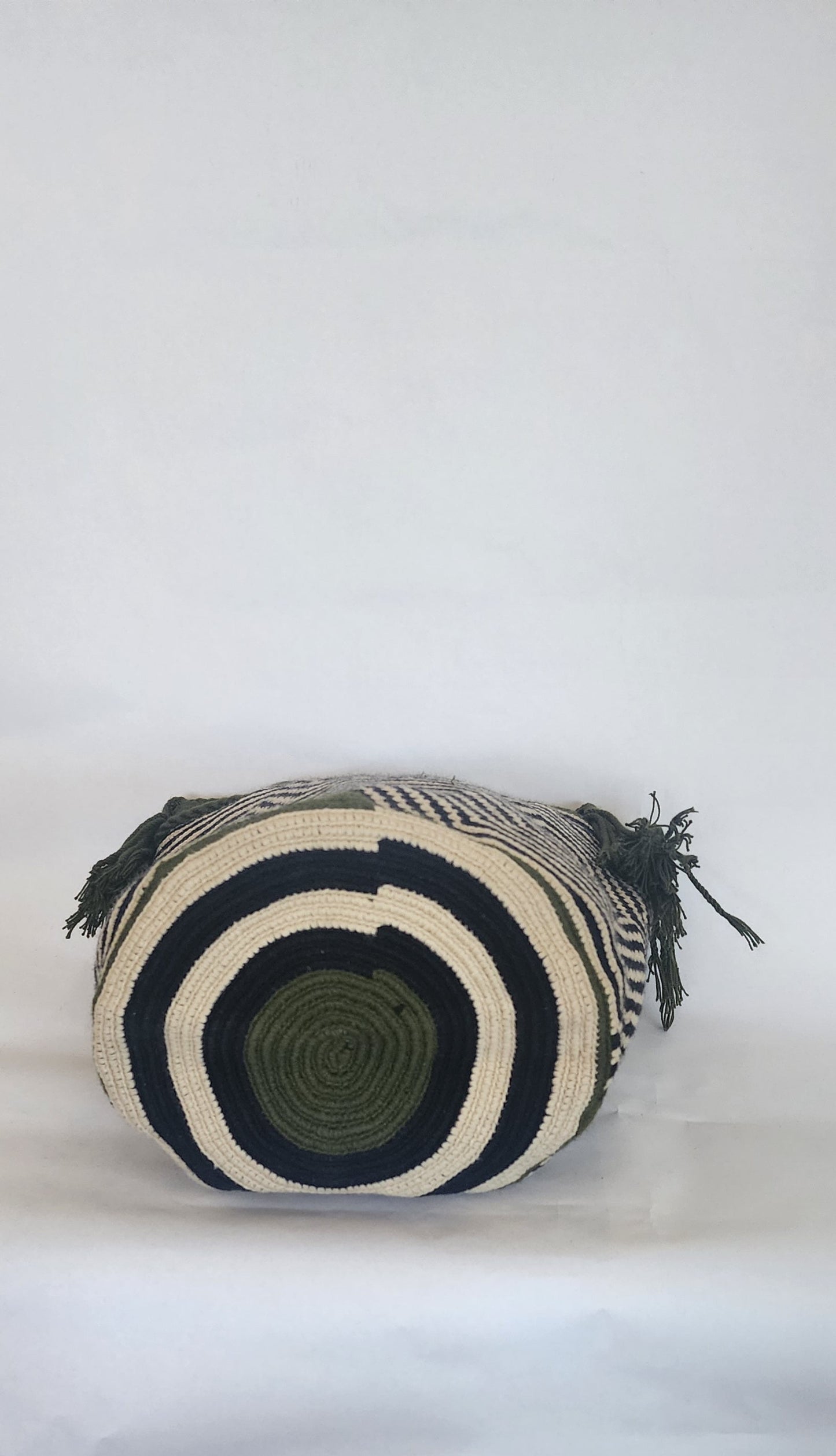 "Colorful handmade Crochet Wayuu bag with geometric motifs, crafted by indigenous artisans, perfect for versatile use."