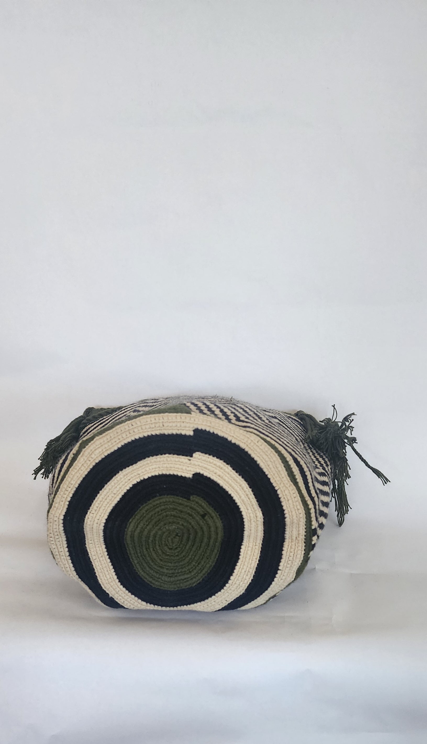 "Colorful handmade Crochet Wayuu bag with geometric motifs, crafted by indigenous artisans, perfect for versatile use."
