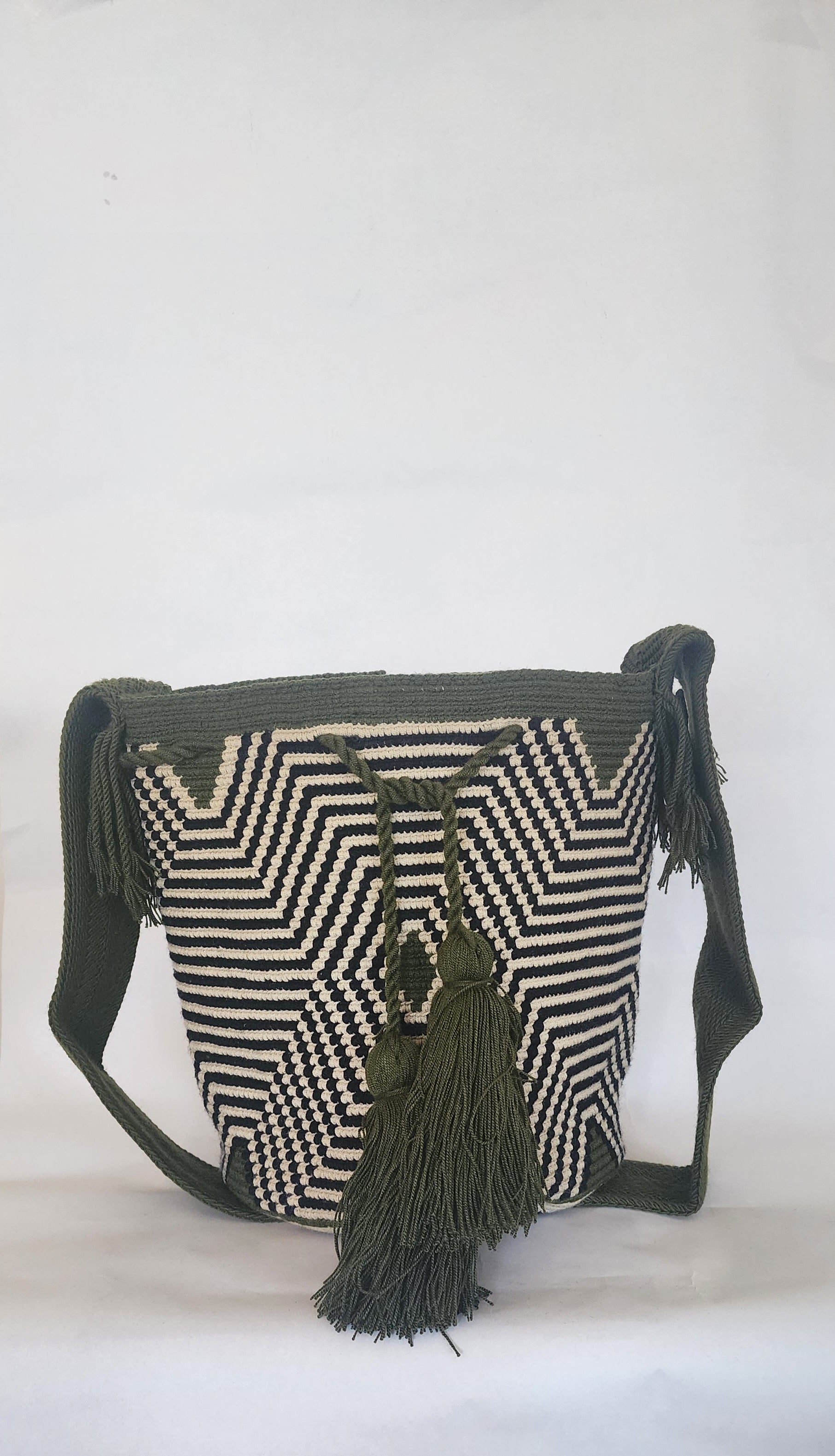 "Colorful handmade Crochet Wayuu bag with geometric motifs, crafted by indigenous artisans, perfect for versatile use."