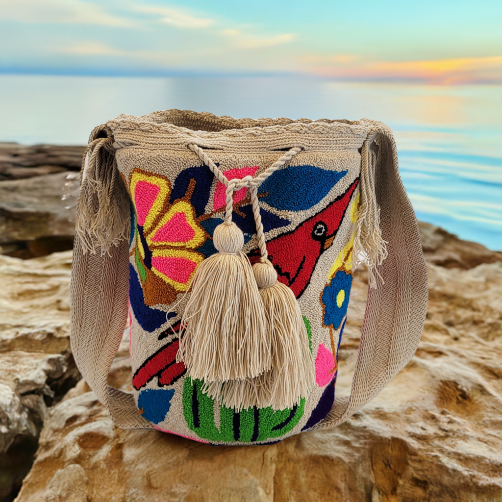 "Colorful handmade crochet Wayuu bag with vibrant geometric patterns, showcasing artisan craftsmanship and bohemian style."