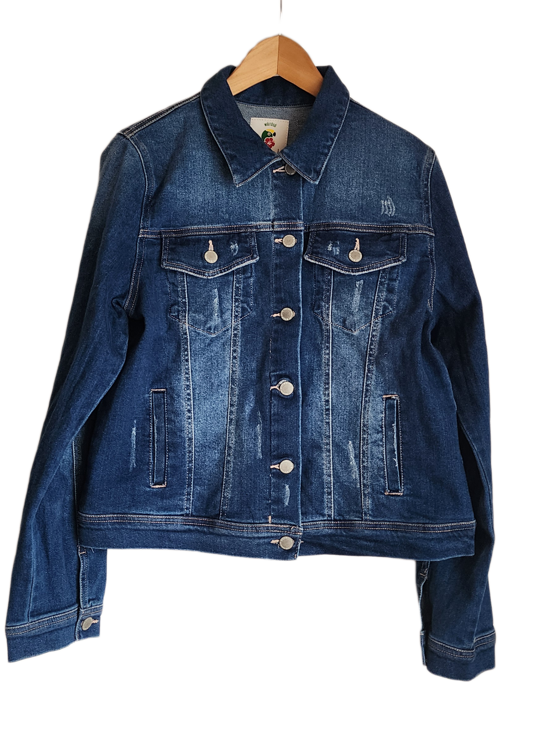 "Colorful handmade punch needle denim jacket with vibrant Wayuu-inspired embroidery, showcasing bohemian style and craftsmans