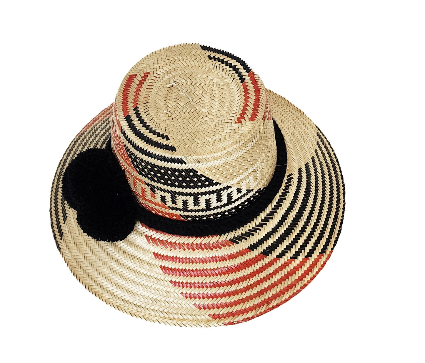 "Colorful handmade straw hats by Wuitusu, crafted by the Wayuu tribe using dyed Iraca palm fibers, with adjustable sizing and
