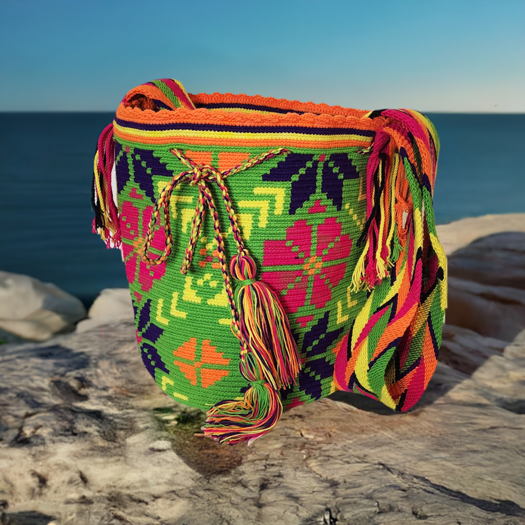 "Colorful handmade Wayuu crochet bag with intricate patterns, adjustable strap, showcasing bohemian charm and artisan craftsm