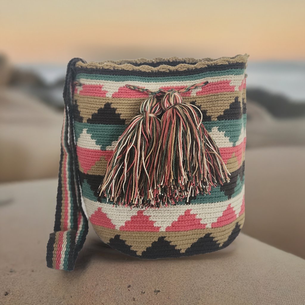 Handmade Wayuu crochet bag with colorful diamond patterns and tassels — a bold artisan piece for boho-chic everyday wear.