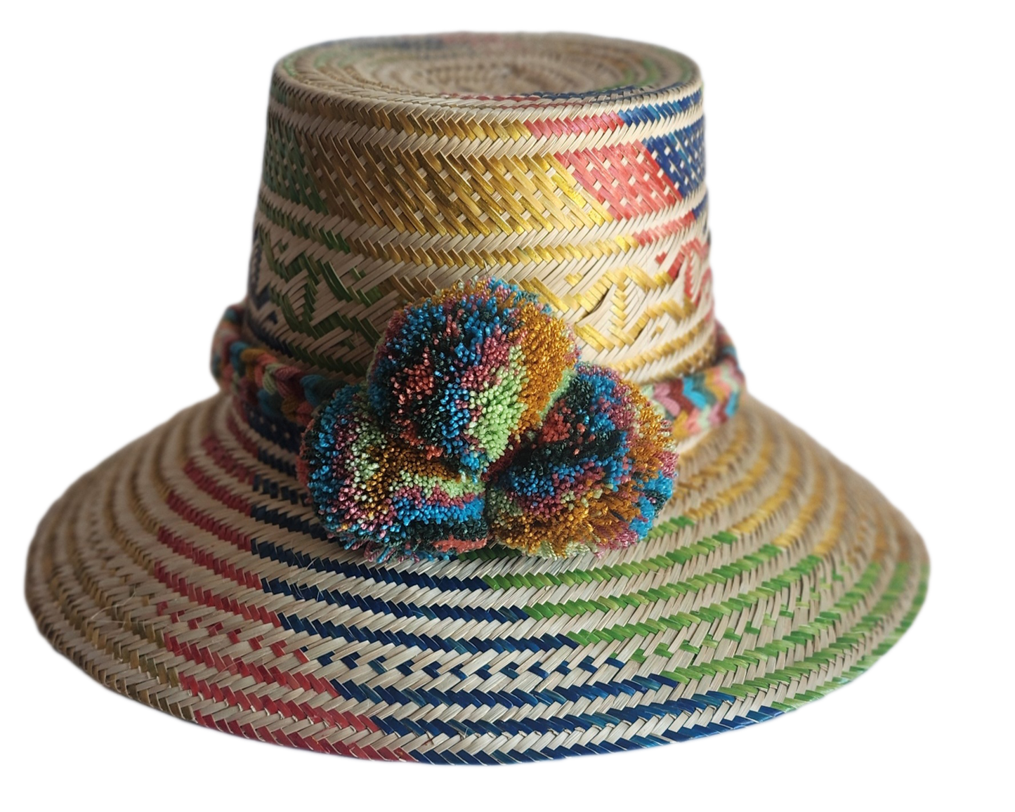 "Colorful handmade Wayuu hat by Wuitusu, crafted from Iraca palm fibers, adorned with culturally significant pompoms."