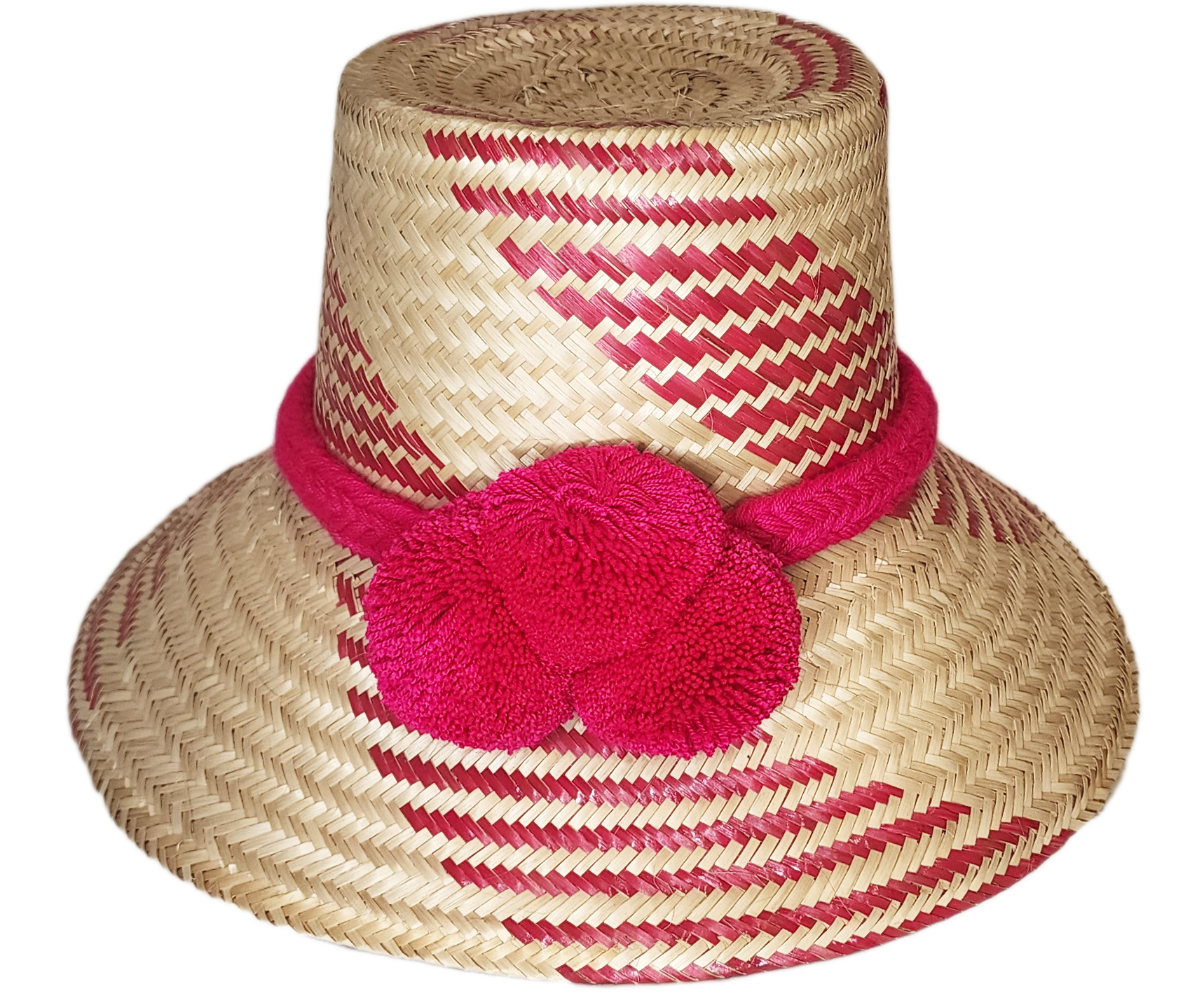 "Colorful handmade Wayuu hat crafted from Iraca palm fiber, adorned with significant pompoms, from Colombia and Venezuela."