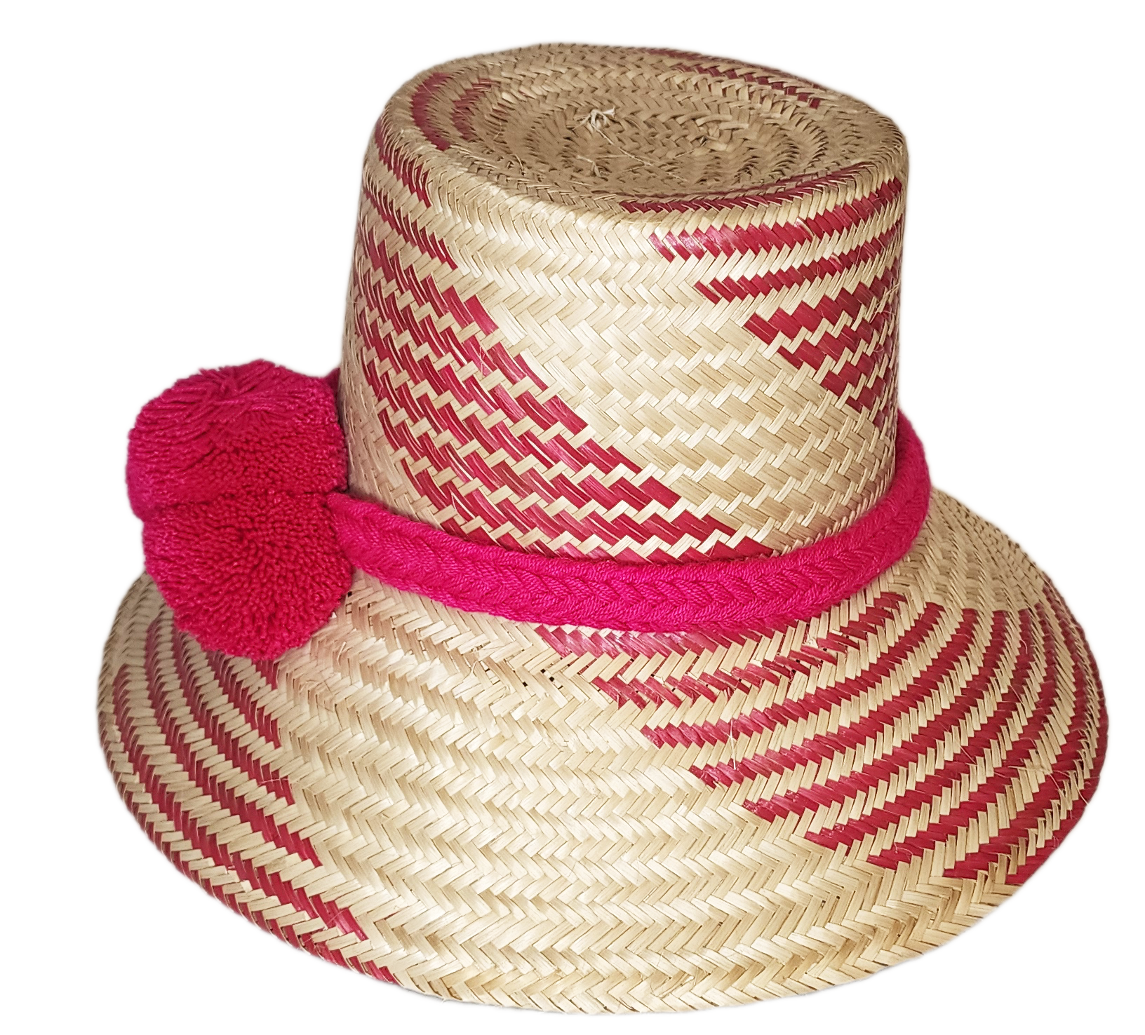 "Colorful handmade Wayuu hat crafted from Iraca palm fiber, adorned with significant pompoms, from Colombia and Venezuela."