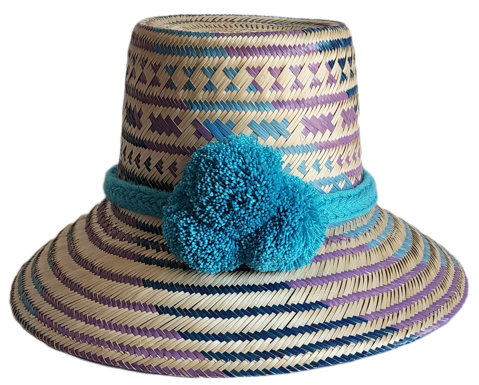 "Colorful handmade Wayuu hat crafted from Iraca palm fibers, adorned with meaningful pompoms, adjustable fit."