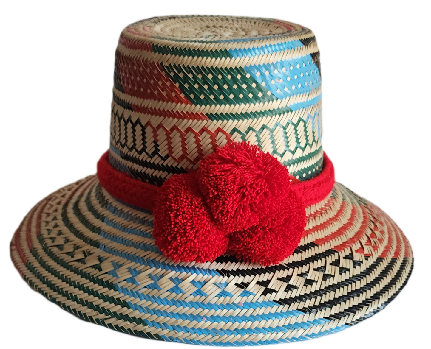 "Colorful handmade Wayuu hat crafted from Iraca palm fibers, adorned with significant pompoms, and adjustable for a perfect f