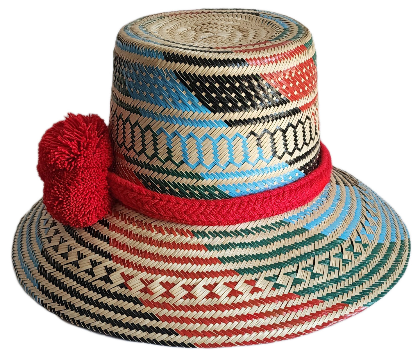 "Colorful handmade Wayuu hat crafted from Iraca palm fibers, adorned with significant pompoms, and adjustable for a perfect f