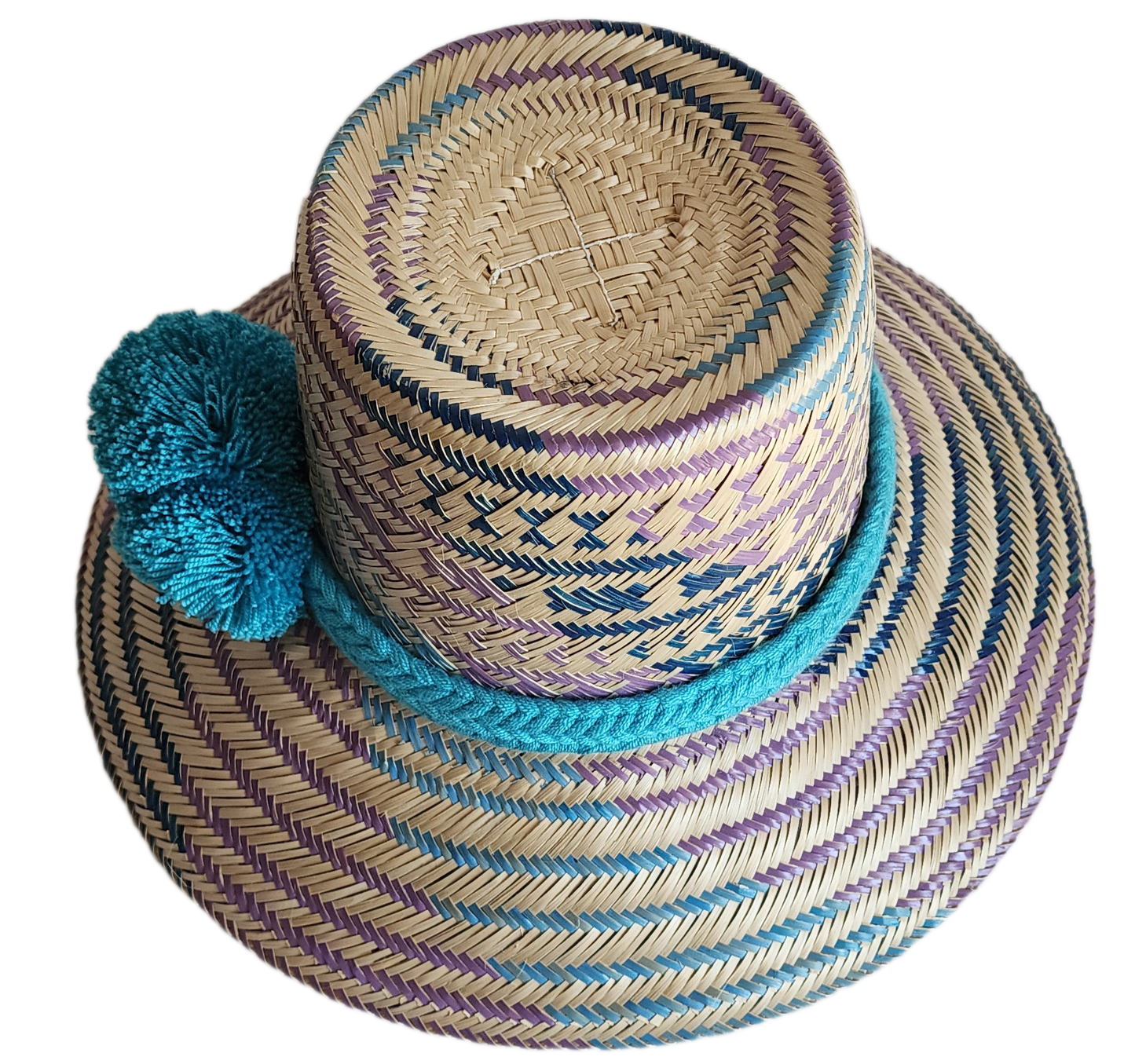 "Colorful handmade Wayuu hat crafted from Iraca palm fibers, adorned with meaningful pompoms, adjustable fit."
