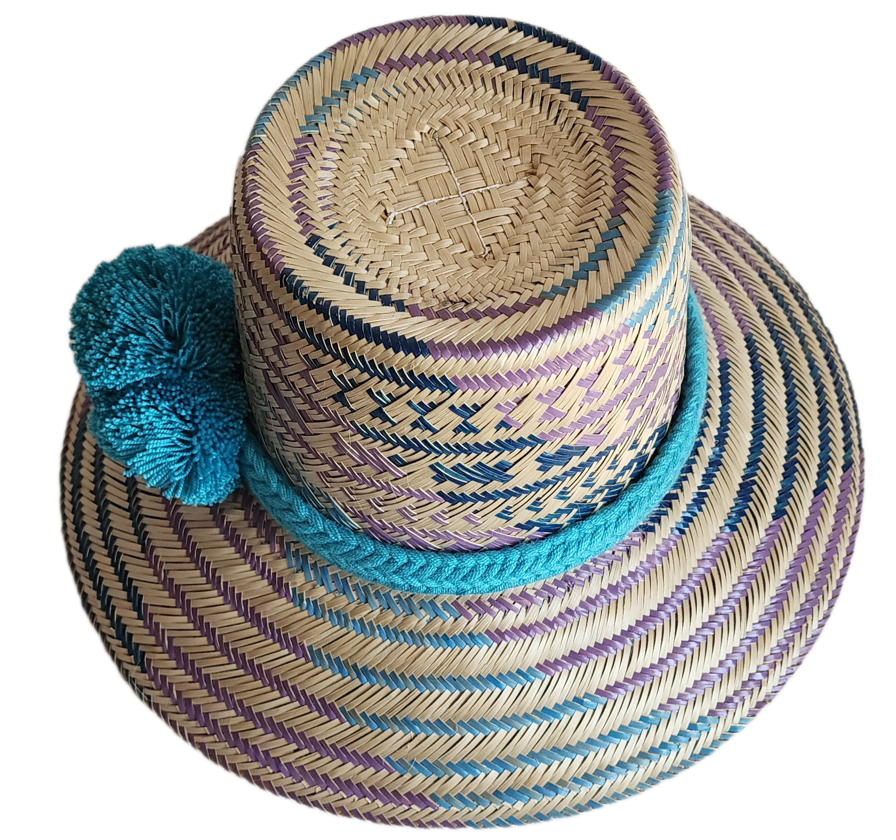 "Colorful handmade Wayuu hat crafted from Iraca palm fibers, adorned with meaningful pompoms, adjustable fit."