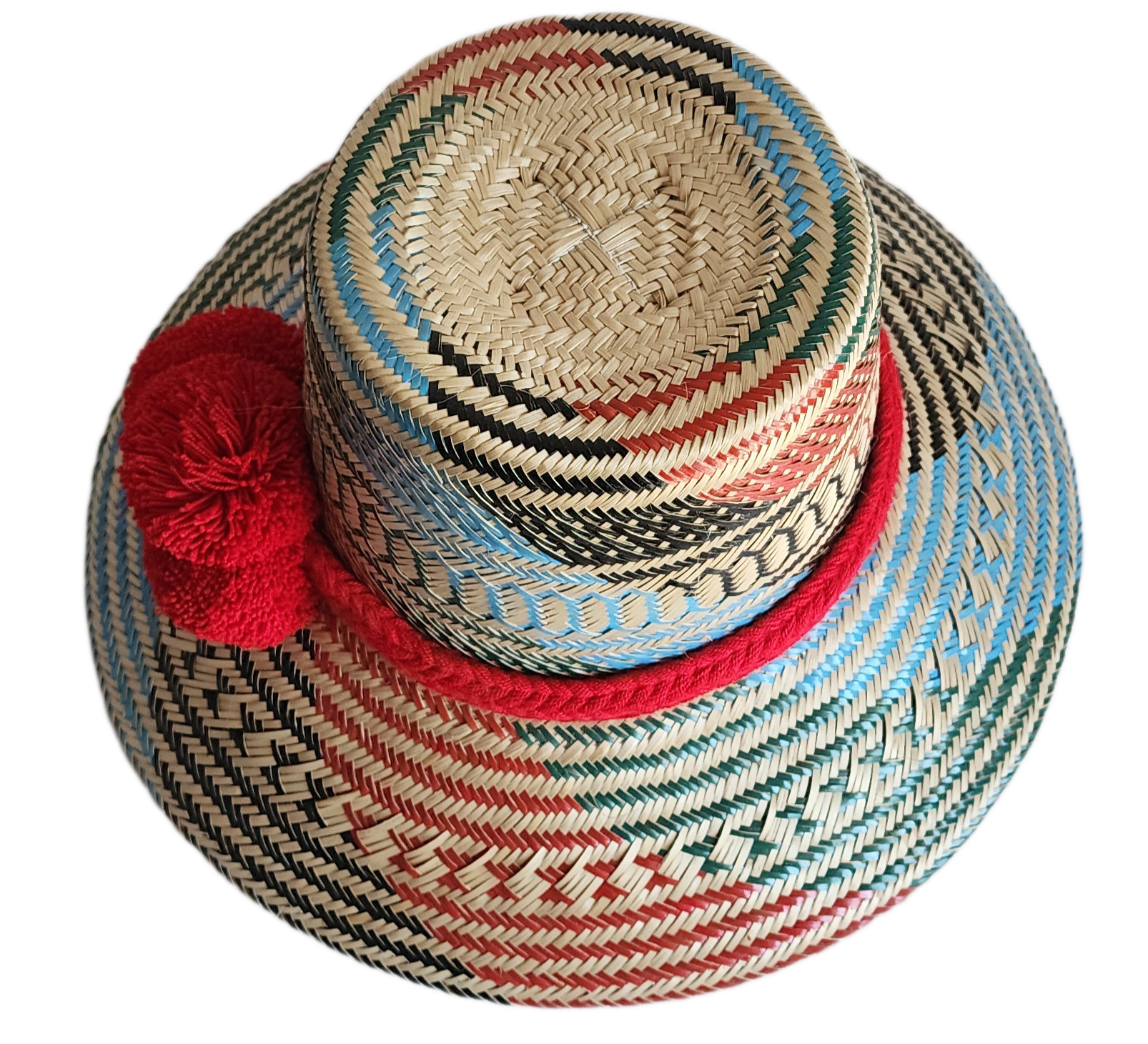 "Colorful handmade Wayuu hat crafted from Iraca palm fibers, adorned with significant pompoms, and adjustable for a perfect f